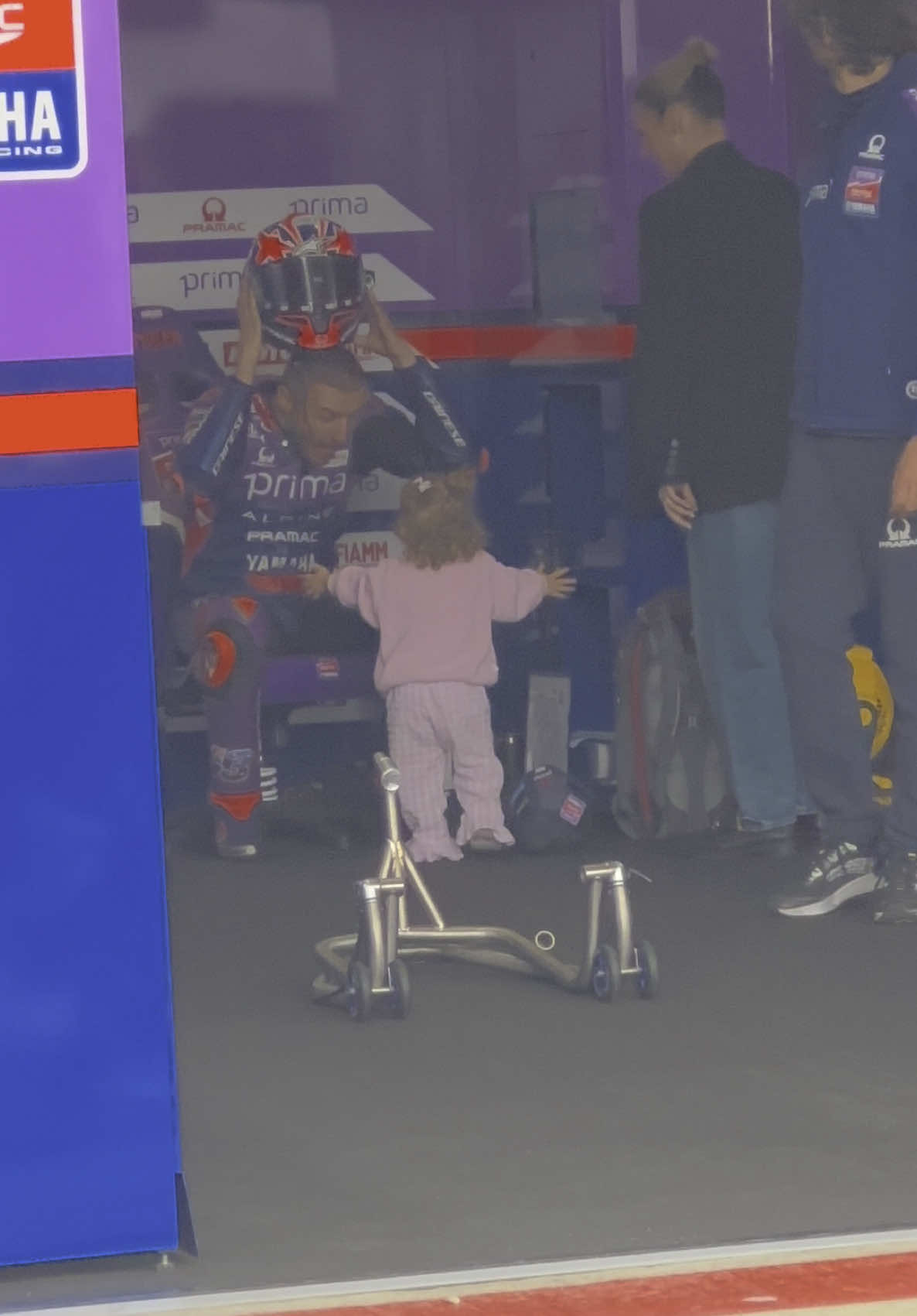A sweet moment between Jack Miller and daughter Pip at MotoGP Silverstone. Post qualifying. @MotoGP™ @Silverstone #motogp #motogpsilverstone #jackmiller #silverstonecircuit #pramacracing 