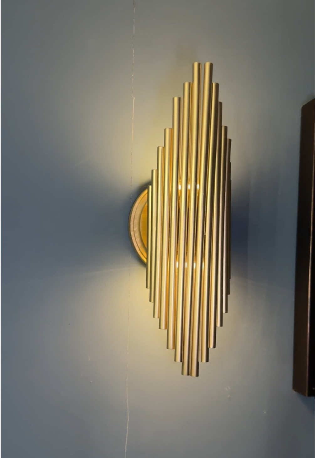 DIY Luxury Wall Light for less using only Dollar Tree products. #diyproject #dollartreediy #wallsconces #diyhomedecor 