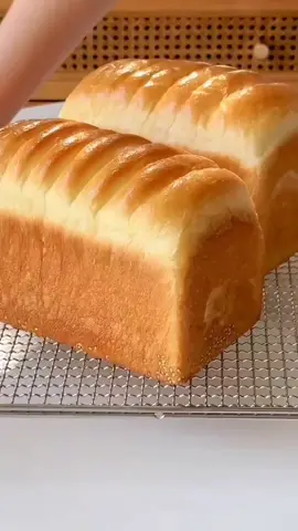 Butter Toast Bread 🍞 preparation bread flour 500g sugar 50g salt 8g instant yeast powder 8g one large egg fresh milk 280g knead the dough for 8min butter 40g knead the dough for 5min cover the dough rest the dough for 60min separate the dough into two pieces make balls cover the dough rest the dough for 15min make the bread roll the dough each bread 30g butter sesame seeds cut the bread on the top bread mold 450g rest the dough for 60min or until double in size Bake in a preheated oven 180C 25 to 28min depends on the oven brush with butter  #bread #Recipe #fyp #balkan 