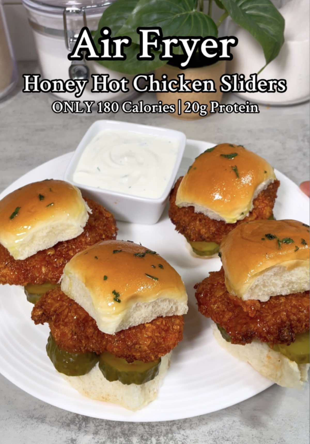 air fryer hot honey chicken sliders (:  only 180 calories + 20g protein per slider ✅ ✅ grab my cookbook for more recipes! link is in my bio! ✅ ingredients⬇️:  4 pieces of 75g chicken breasts (85 calories each)  4 pieces of low calorie slider bread (60 calories each)  1 cup of plain cornflakes (100 calories)  1/4 cup egg whites (33 calories)  1/3 cup hot sauce (zero calories)  2 tbsps swerve brown sugar (zero calories)  pickles (5 calories)  seasoning: salt/pepper, garlic/onion powder, paprika, & garlic + herb seasoning  #chickenrecipe #chickensliders #EasyRecipe #lowcalorie #highprotein #airfryer #creatorsearchinsights 