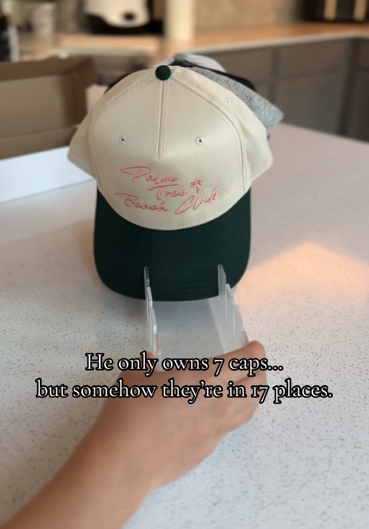 Why do men act like their hats will walk themselves back into place? This clear acrylic rack was $11 and saved me from passive-aggressively moving caps every day. Simple, clean, no tools, no excuses.