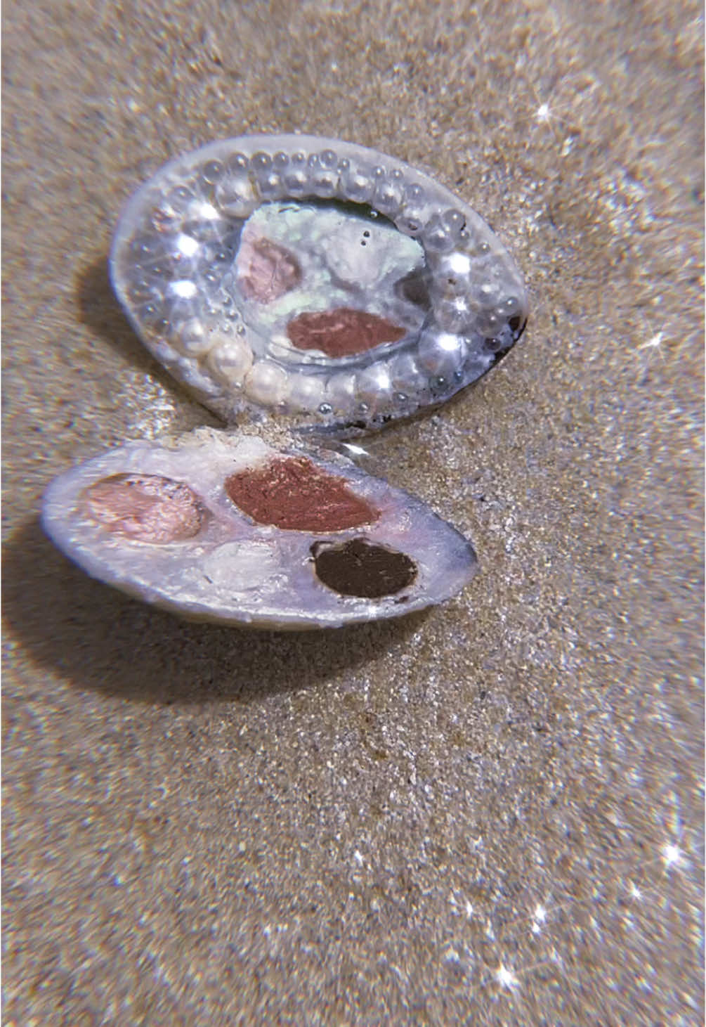 Mermaid mini compact 🧜‍♀️ She’s a little janky from being made in a hotel room with a pair of eyebrow tweezers and a can do attitude, but also I love her like my child so anyway- Used:  * Clam shell I stole off my brothers plate at dinner  * DIY paper clay: toilet paper + white glue  and a bit of water mixed to a tar-like consistency)  * Harvested mirror from wet & wild brow pallet (RIP 🪦) * Pearl beads  * Mini shells for pallet pots  * Bayfree multi glow balm in Pink Sakura  * Nyx jumbo eye pencil in 02 vanilla ice cream  * Wet & wild ultimate brow kit in dark brown * Sally Hansen insta dry polish in Cromatica  #craft #minicraft #DIY #mermaidcore #makewithme #makeupdiy