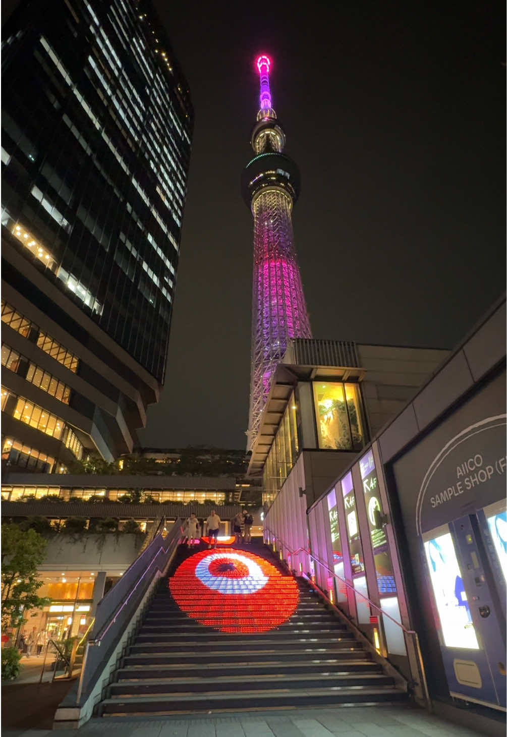 Tokyo Skytree Night View! 🌃 Witness stunning view to Skytree and LCD show on the stairs near Tokyo Solamachi.  For the exact location search: 📍Oshiage Police Box   #tokyoskytree #japan #japan #japanorama #japantraveltips #japantravelguide ##visitjapan #TravelJapan #JapanTravel #ExploreJapan #JapanNature #ScenicJapan #TravelTok #JapanAdventure #BeautifulDestinations #bucketlistdestinations #dreamcountryjapan #dreamcountry
