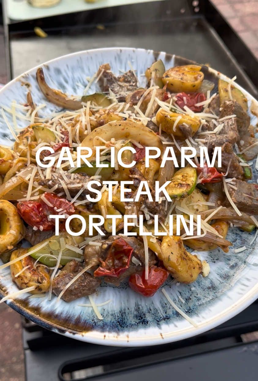 Made this one once in the kitchen sometime last year… and man it was so much easier on the blackstone😮‍💨.   Fixings 🗒️✏️  Steak: *Thin cut ny strip *Olive Oil *Kinders Buttery Steakhouse *Grass fed butter Vegetables & Tortellini *Frozen Tortellini *Onion *Cherry Tomatoes  *Zucchini *Kinders Buttery Garlic & Herb  *BWW Parmesan Garlic *Parmesan #BWWParmesanGarlic #blackstone #griddle #flattop #Steak #dinner #easydinnerideas #voodooranger