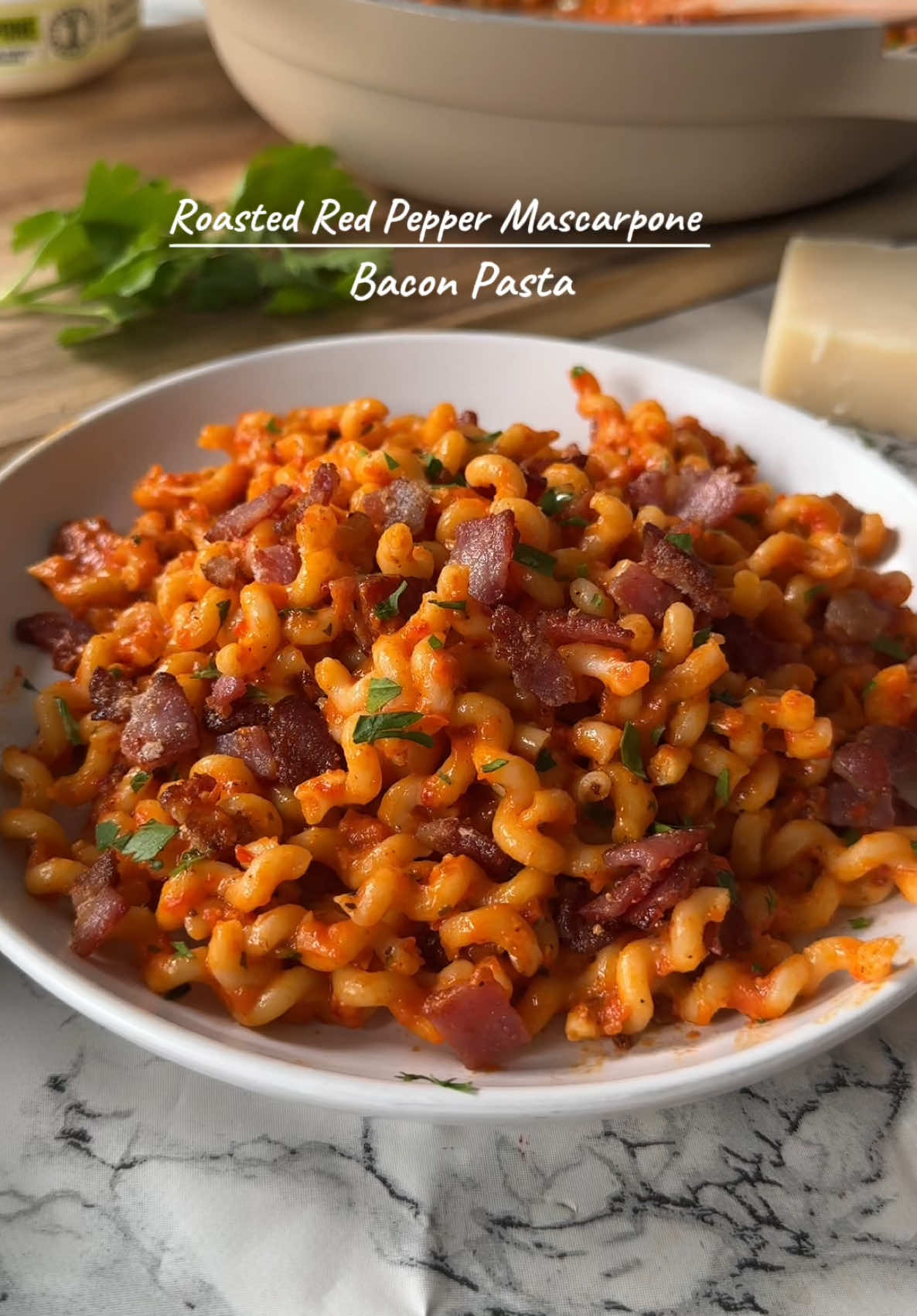 * CREAMY RED PEPPER BACON PASTA  * Jarred roasted red peppers are a hero ingredient, wizzed together with mascarpone it makes a dreamy sauce for pasta, top it with crispy salty bacon and you can have this dish on the table in 15 minutes!  * Serves 4  * Cals 610 | Pro 23 | Carb 64 | Fat 28  * Ingredients ~  * 300g dried pasta  * 100g Parmesan  * 325g jarred roasted red peppers  * 6 slices, thick cut bacon  * 1 tsp each of paprika, garlic, onion, Italian seasoning  * 150g mascarpone  * Method ~  * Boil the pasta and cook the bacon  * Whizz together peppers, mascarpone, seasonings, salt, and pepper  * Drain the pasta and reserve a mug full of cooking water, pour over the sauce and cook for a couple of minutes, add pasta water and 2/3 Parmesan, cook again for a couple of minutes and finish with bacon, remaining cheese and optional parsley  * Hope you enjoy!  * Xx