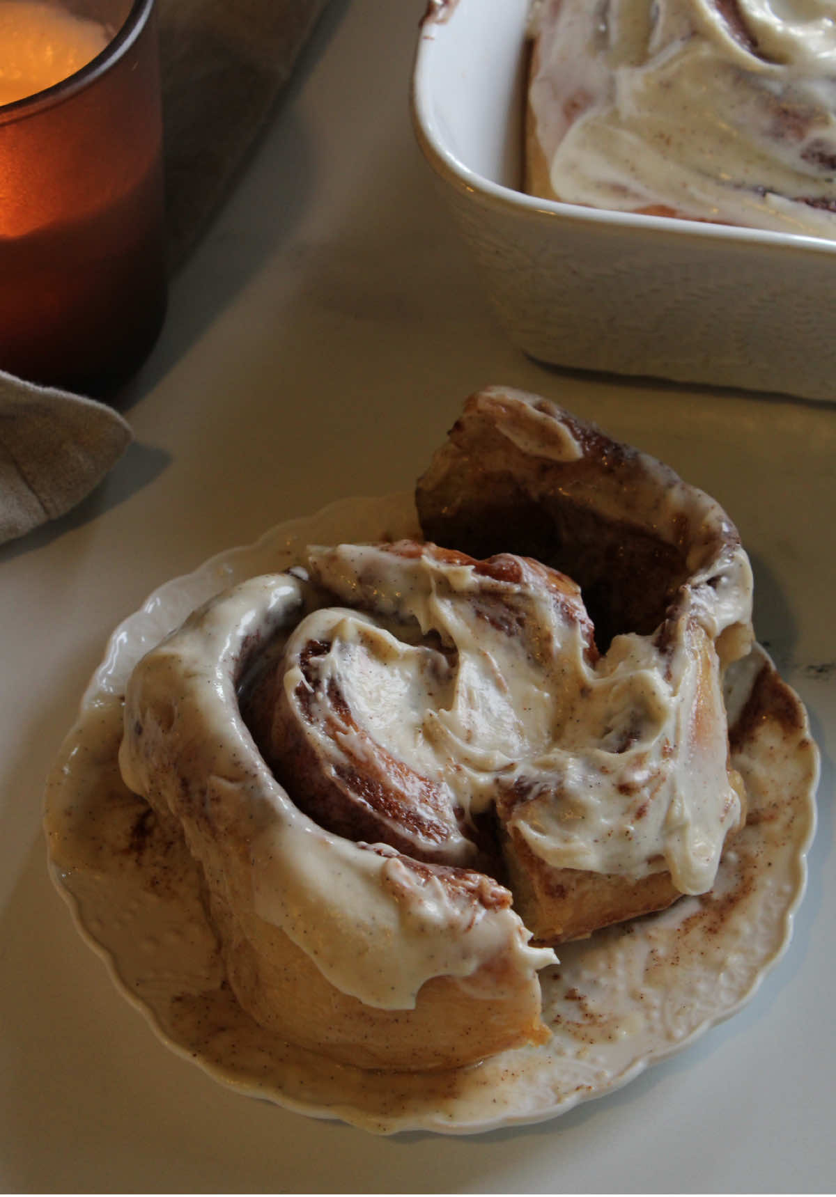 This is my sourdough cinnamon roll recipe 💫 Made with an active starter, a soft and fluffy dough, and a creamy cinnamon filling that melts into every swirl 🌀 It took me several tries to get it just right, but now I can finally say — this one’s mine 💛 Save it, try it, and let me know what you think!  Dough Ingredients 	•	680 g all-purpose flour 	•	400 g milk 	•	70 g sugar (or honey) 	•	12 g salt 	•	120 g sourdough ( active )  	•	1 whole egg + 1 yolk 	•	1 tsp vanilla extract 	•	1/2 tbsp cinnamon 	•	90 g unsalted butter Filling 	•	220 g unsalted butter, room temperature 	•	230 g sugar      •     4-5 cucharadas de canela  Mix ingredients until smooth and creamy. Set aside at room temperature. Frosting 	•	170 g (6 oz) cream cheese 	•	7 tbsp unsalted butter 	•	1 tbsp vanilla extract 	•	1 ½ cups powdered sugar Beat all ingredients together until smooth and fluffy. 🌀 Step-by-Step Instructions 1. Initial mix In a large bowl, combine all dough ingredients except for the butter. Mix until everything is well incorporated — no need to knead yet. Cover and let the dough rest for 20 minutes (this helps with hydration and gluten development). 2. Kneading with butter After resting, knead the dough (by hand or with a mixer). Once it feels slightly elastic, start adding the butter gradually, one piece at a time. Keep kneading until the dough is smooth, soft, and just a bit sticky. 3. First rise (bulk fermentation) Place the dough in a greased bowl, cover it, and let it ferment at room temperature for 4–6 hours, or until it increases by about 40% in volume. 4. Cold proof Transfer the dough to the fridge and let it rest overnight. This makes the dough easier to work with and improves the flavor. 5. Warm up the dough The next day, remove the dough from the fridge and let it sit for 10 minutes at room temperature before rolling it out. 6. Prepare the filling Mix the room-temp butter and sugar spread together until creamy. Set aside at room temperature so it stays spreadable. 7. Roll and fill Lightly grease your surface (use butter, not flour) and roll the dough into a rectangle. Spread the filling evenly over the dough. Roll it tightly from the long edge into a log. Tip: If the dough is sticky, grease your rolling pin too. 8. Shape the rolls Cut the log into 7–8 equal pieces. Place them in a baking dish with just a little space between them so they can expand as they rise. 9. Final proof Cover the pan and let the rolls rise at room temperature for 2/3 hours, or until they’ve doubled in size. 10. Bake Preheat your oven to 320°F  Bake the rolls for 30–35 minutes, or until golden on top and baked through. 11. Frost and decorate Let the rolls cool slightly (not too hot), then spread the cream cheese frosting over the top. #sourdoughcinnamonrolls #CapCut #sourdough #cinnamonroll #bakingtiktok #EasyRecipe #bakingathome #creatorsearchinsights 