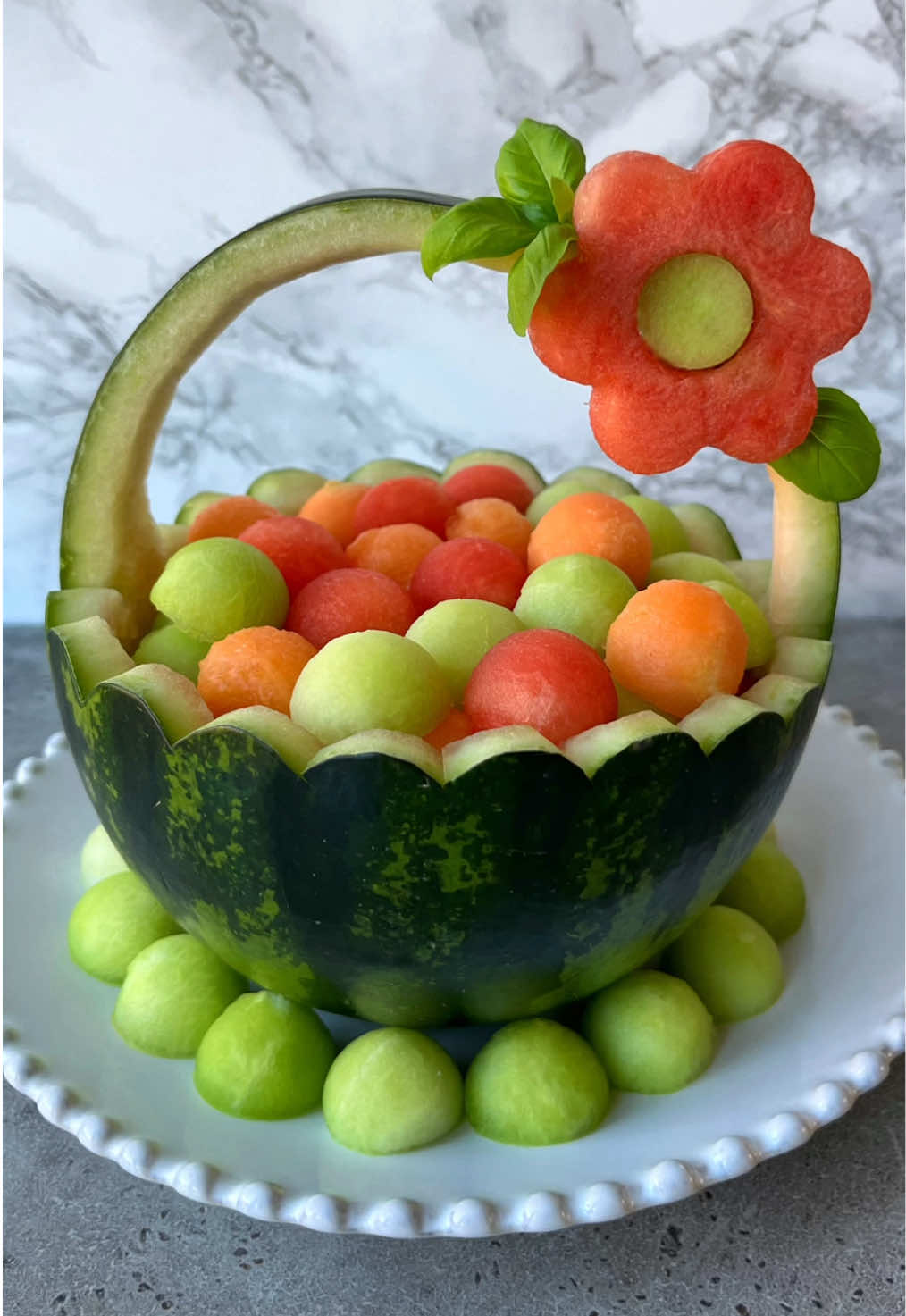Watermelon Basket 🧺 Filled with melon balls for the ultimate showstopping fruit presentation. Hwad to my website (link in bio) for more beautiful fruit ideas or google ‘foodbites fruit’. #watermelon #fruitplatter #fruitsalad #fruit #foodart #fyp #fruitbasket #dessertideas #summerfood