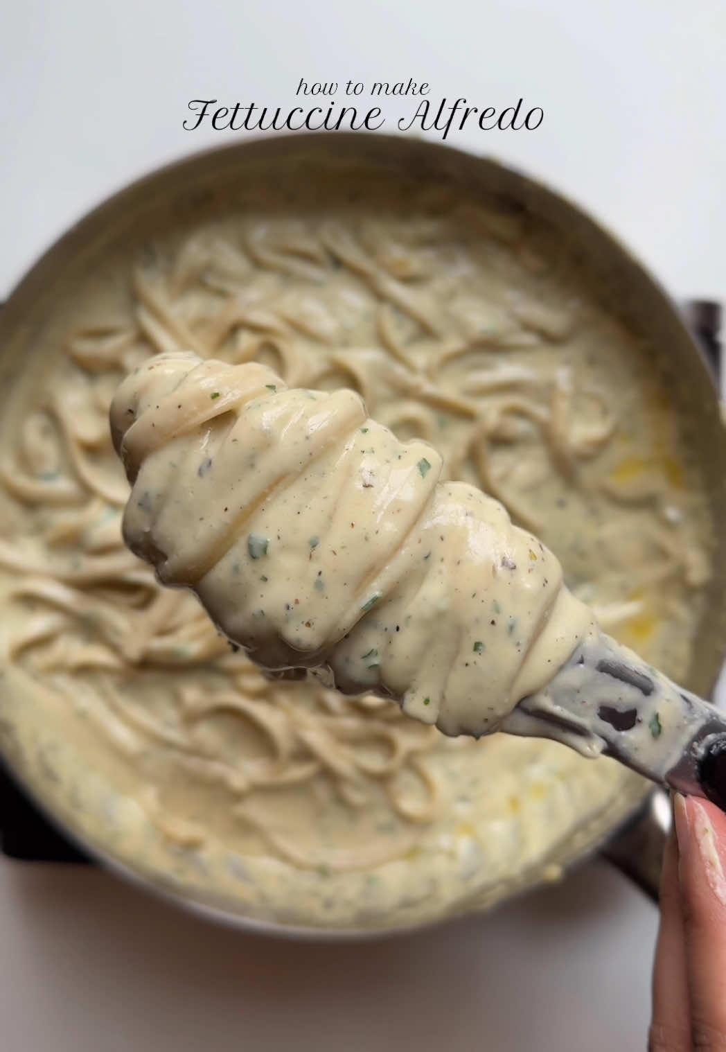Fettuccine Alfredo Ingredients: - 225g fettuccine - Salt to taste - 1 tsp black pepper - 1 tbsp garlic powder - 1 tsp Italian seasoning - 2 tbsp freshly minced parsley - 1/2 cup butter - 2 cup unsweetened heavy whipping cream - 1 cup parmesan cheese - 1 1/2 tbsp all-purpose flour - 1 cup reserved pasta water Method: Bring a large pot of salted water to a boil. Cook the fettuccine according to package instructions until al dente. Reserve 1 cup of pasta water before draining. In a large saucepan, melt the butter over medium heat. Sprinkle flour over the butter mixture and whisk to combine. Cook for 1-2 minutes, stirring constantly. Gradually pour in the heavy whipping cream, whisking continuously to prevent lumps. Bring the mixture to a simmer and cook for 2-3 minutes or until slightly thickened. Remove the saucepan from the heat and stir in parmesan cheese until melted and smooth. Season with salt, black pepper, garlic powder and Italian seasoning. Add the cooked fettuccine to the saucepan and toss to combine, adding reserved pasta water if needed to achieve a creamy consistency. Stir in freshly minced parsley and serve hot. *Tips:* - Use high-quality parmesan cheese for the best flavor. - Don't overcook the fettuccine or sauce. - Adjust the amount of garlic powder and Italian seasoning to taste. #fettuccine #alfredo #pasta #Recipe 