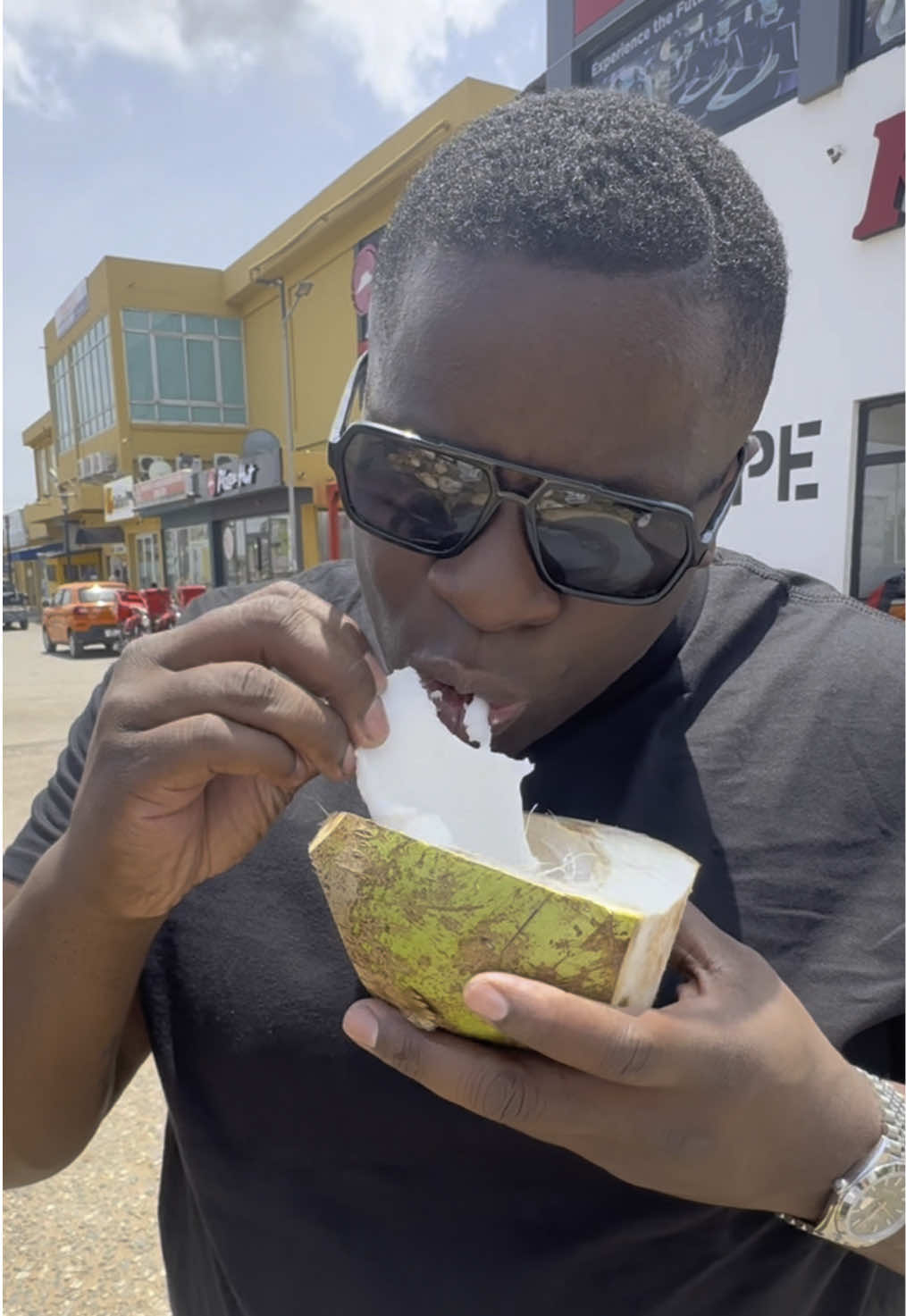 My African American brother trying raw coconut for the first time. His reaction was priceless. Do you only drink the water, or do you eat the coconut too? Let me know in the comments. . . #ghanatiktok🇬🇭 #accraghana 