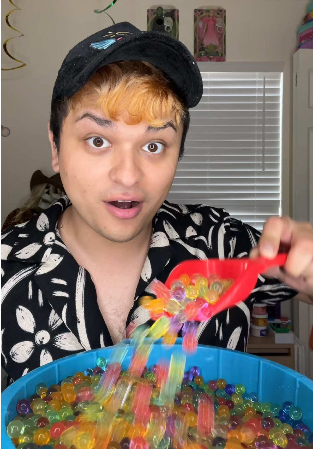 Time to empty the kitty pool full of water beads! 🌈💦  Should I make a giant stress ball with them?? 🤔  #kittypool #waterbeads #stressball #project #experiment 