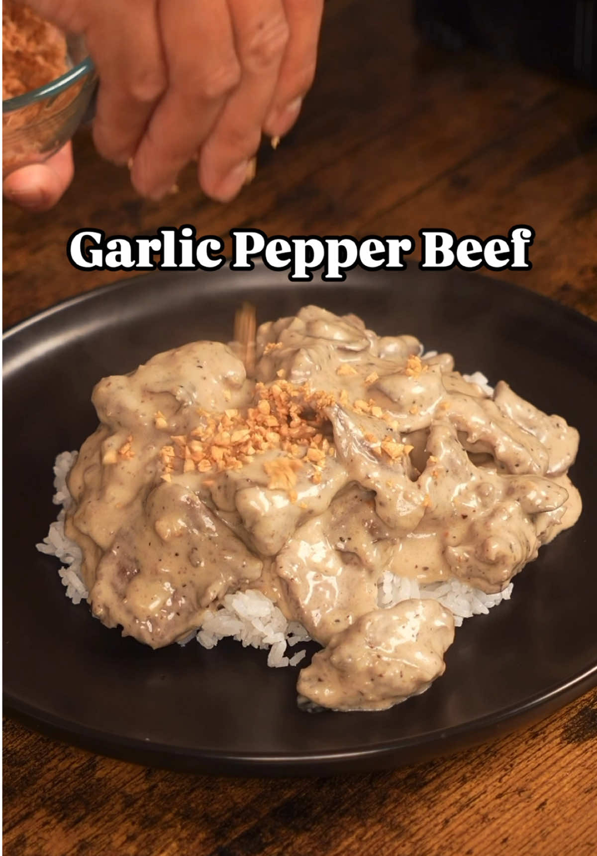 Jollibee-Style Garlic Pepper Beef Tender beef slices in a creamy mushroom-pepper gravy, topped with golden toasted garlic—this homemade take on a Jollibee favorite is rich, savory, and perfect over steamed rice. Ingredients Beef & Garlic: * 1.5 lbs beef chuck, thinly sliced against the grain * 12 cloves garlic, finely chopped Marinade: * 3 Tbsp cornstarch * 1 Tbsp soy sauce * 1 Tbsp oyster sauce * 1 Tbsp black pepper * 1 Tbsp garlic powder * 1 tsp sugar Cream Sauce: * 1 cup mushrooms (any kind), chopped * 1 cup heavy cream * ½ cup water * 1 beef bouillon cube * 1 tsp soy sauce, or to taste * 1 Tbsp black pepper, or to taste * Kosher salt, to taste Instructions 1. Toast the Garlic: In a cold pan, add chopped garlic and enough oil to cover. Slowly heat over low, stirring until golden brown. Strain and set aside the garlic. Reserve 3 Tbsp of the garlic oil. 2. Marinate the Beef: Combine sliced beef with all marinade ingredients. Mix well and let it rest for at least 15 minutes. 3. Pre-cook the Beef: Boil 6 cups of water. Blanch the marinated beef in batches for 1 minute each. Set aside. 4. Make the Sauce: In a pan over medium heat, add 3 Tbsp garlic oil. Toast 1 tsp black pepper, then add mushrooms and sauté for 5 minutes. Add the pre-cooked beef, water, cream, bouillon cube, soy sauce, additional pepper, and salt. Stir in half of the toasted garlic. Simmer for 5–8 minutes until thickened to a gravy-like consistency. 5. Serve: Spoon over steamed white rice and top with remaining toasted garlic. Enjoy! #jollibee #garlicpepperbeef #beefstronganoff #Recipe #EasyRecipes #EasyRecipe #easy #lunch #dinner #lunchideas #DinnerIdeas #food #recipes #recipe #cooking #beef #steak 