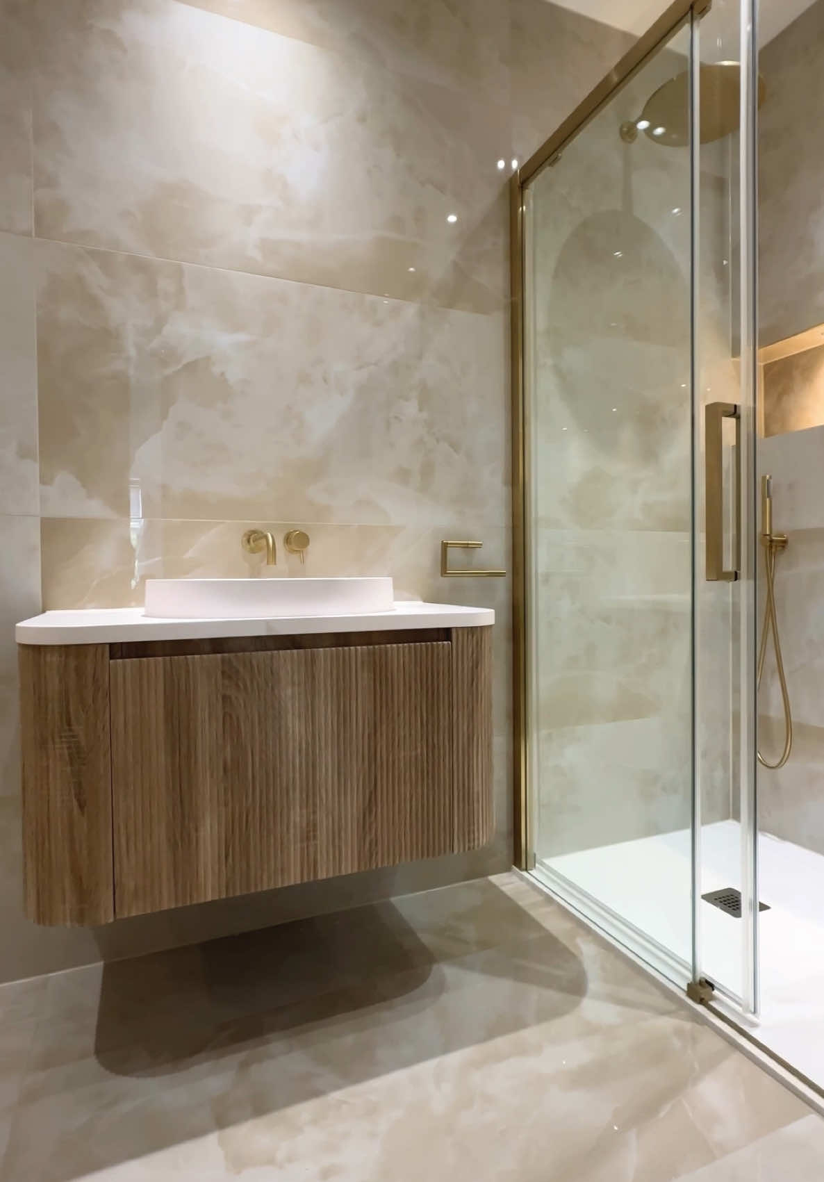 En-suite of dreams 💤🫧 Out Beutiful Onyx Infity Pearl 🤍 A Bathroom adorned with pearl onyx porcelain tiles offers a serene and elegant ambiance, combining the timeless beauty of onyx with the durability and practicality porcelain  🛁🚿 #nsgtiles #bathroomrenovation #bathroominspo #homedecor #londontiles #bathroomdesign #porcelain #bathroomgoals #porcelaintiles #pearl #onyx