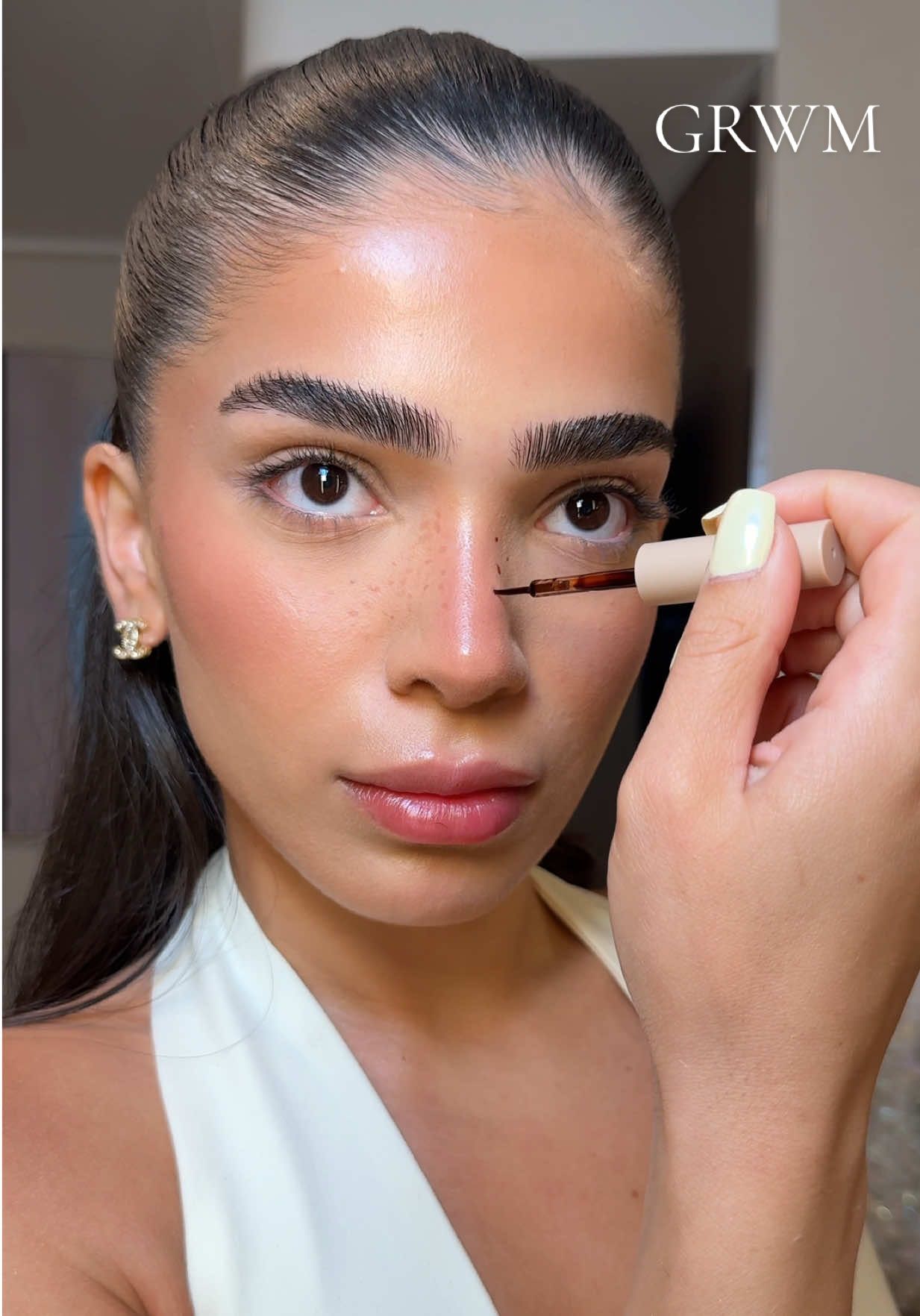 vacation glam just hits harder #MakeupRoutine  Products:  - @rhode skin glazing milk - @L’Oréal Paris 24hr brow lamination - @Hourglass Cosmetics concealer in FAWN - @Diorbeauty hydra nude foundation in 2.5N, jumbo bronzer in 30 - @Saie sunmelt in TAN BRONZE, powder blush in MIA - @REFY cream blush in cherry, lash sculpt mascara  - @Huda Beauty powder in Banana - @Haus Labs by Lady Gaga glass highlighting bomb in translucent  - @makeupforever lip liner in up & down tan - @Jason Wu Beauty faux freckles & 01 eyeshadow palette - @Charlotte Tilbury air brush setting spray 