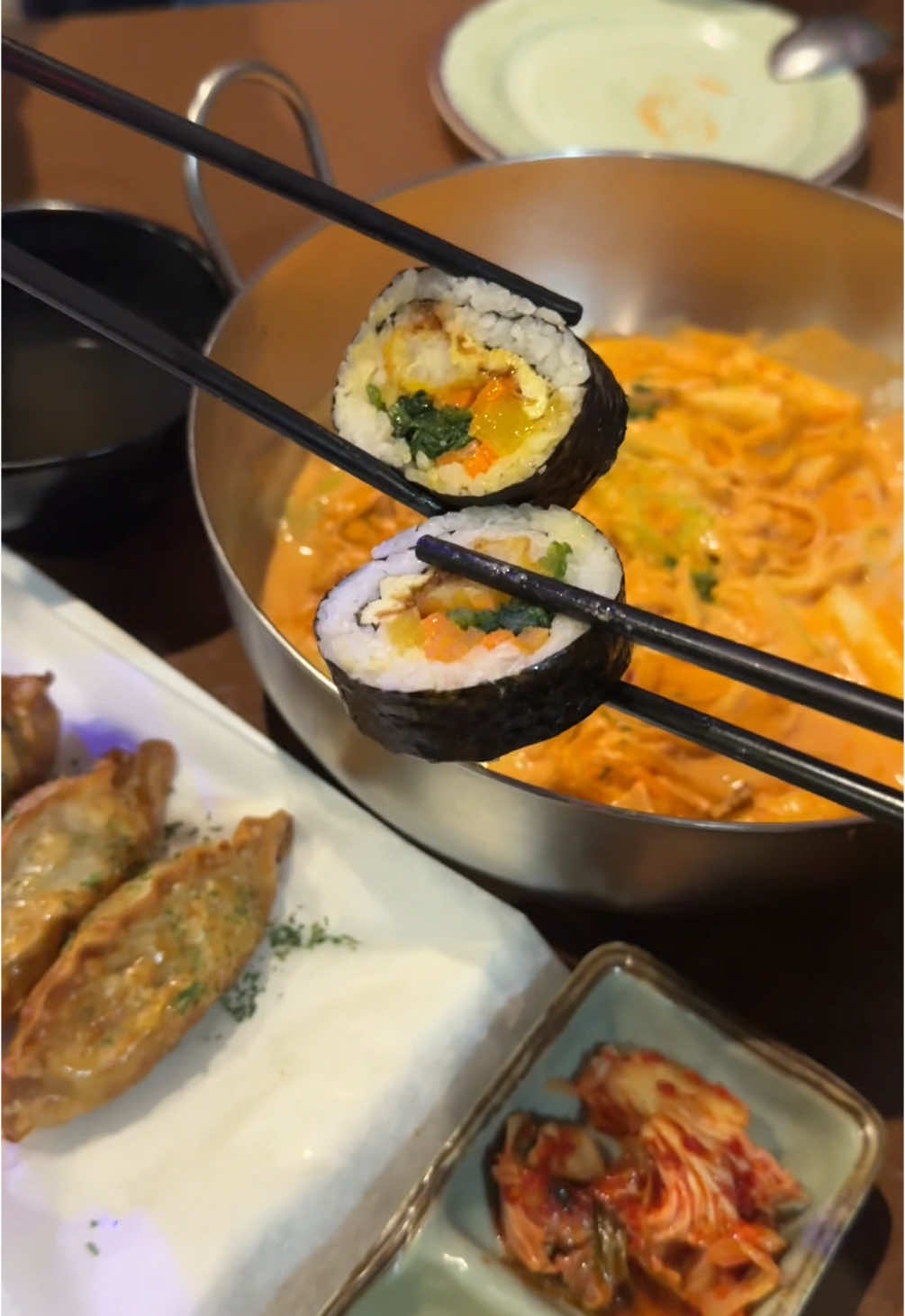 always passed by this place & never stopped to try but their spicy rose rice cake caught my eye!! we got it w. chewy noodles and it was the perfect amount of spice and creaminess, but it didn’t have fish cake like the description stated so i was a tad bit disappointed bc that’s my favorite part of spicy rice cakes 😔 their fried dumplings & fried shrimp kimbap were also really good but i would skip the fish cake kimbap & beef triangle roll next time bc the fish cake was deep fried so much that it was kind of hard and flavorless, and the onigiri lacked flavor overall although the beef was good on its own! overall would come again if i were craving rose tteokbokki 🙂‍↕️📍BUNSIK Korean Street Food, Flushing, Queens #flushing #flushingnyc #queens #queenseats #nyc #nyceats #korean #koreanfood #koreanstreetfood #tteok #tteokbokki #rosetteokbokki #kimbap 