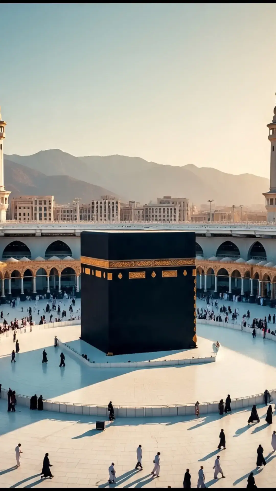 The image you shared is a stunning depiction of the Kaaba in Masjid al-Haram, Mecca, with worshippers walking around it during what appears to be either sunrise or sunset. The scene is framed with palm trees and flowers, adding a peaceful and spiritual vibe to the moment.