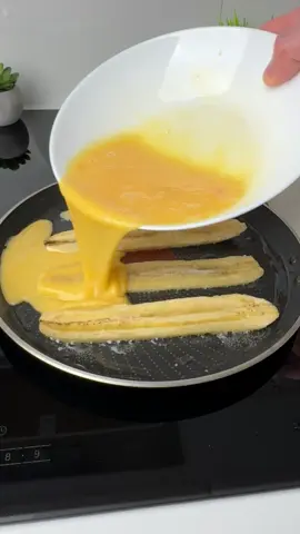 #VNVideoEditor                                          How to Make Banana Egg Rolls.                     HOW TO MAKE A DELICIOUS BREAKFAST - BANANA EGG ROLLS INGREDIENTS: ●Bananas - 1 pcs. ●Eggs - 3 pc. ●Vegetable oil - 1 tbsp. ●Sesame - 1 tbsp. (optional) 1. Peel the banana and cut into thin strips, about 0.5 cm thick. 2. Grease a heated frying pan with vegetable oil and lay out 4 strips as shown in the video. Cook on a slightly lower than medium heat. 3. Mix three eggs well with a fork or whisk and pour the egg mixture on top of the banana. 4. When the egg mixture becomes thicker, sprinkle with sesame seeds and roll the omelette into a roll with a spatula. ●It's incredibly delicious and very simple!!!● Bon appetit! The recipe in your language is available in the description, 💖🇺🇦🇵🇱🇩🇪🇺🇸🇫🇰🇪🇸🇵🇹🇮🇹🇷🇴 🇷🇸🇭🇷🇱🇻🇸🇮🇨🇿🇫🇮🇸🇪🇩🇰🇳🇴 🇯🇵 🇬🇷 🇮🇱🇰🇿🇰🇬🇱🇻🇹🇼 🇵🇪 🇦🇷 🇨🇱 🇻🇪 🇹🇭 🇧🇷                           #banana #egg #Recipe #breakfast #simplydeliciousrecipes 