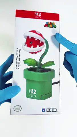 Câmera Hori Nintendo Switch 2 Piranha Plant Edition Capture seus momentos gamers com estilo! A Câmera Hori para Nintendo Switch 2 Piranha Plant Edition traz um design exclusivo inspirado no clássico inimigo do Mario, perfeita para fotos e vídeos dentro e fora do jogo. Compacta, fácil de usar e com a qualidade Hori que você já conhece. #Hori #NintendoSwitch2 #PiranhaPlant #GamingAccessory #EdiçãoEspecial