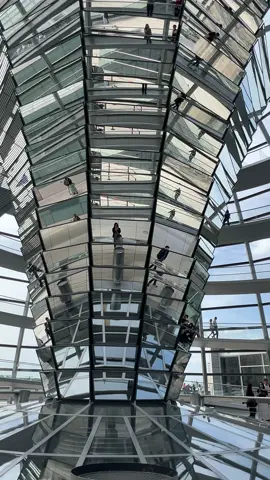 The Reichstag Dome is positioned directly above the debating chamber. At its center, a mirrored cone channels light into the Reichstag, enhancing the building’s energy efficiency and allowing visitors to observe the parliamentary sessions below.  #berlin #adventure #germany #travel #travelphotography #beautifuldestinations #architecture 
