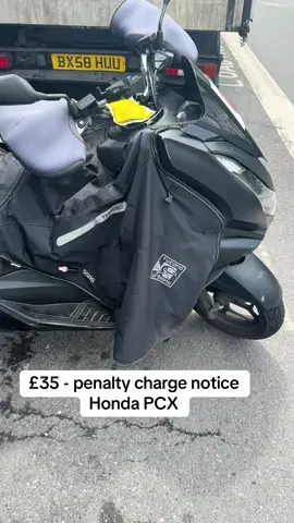 The laws of the loading bay? Ticket inspector operating on Gloucester Road. 