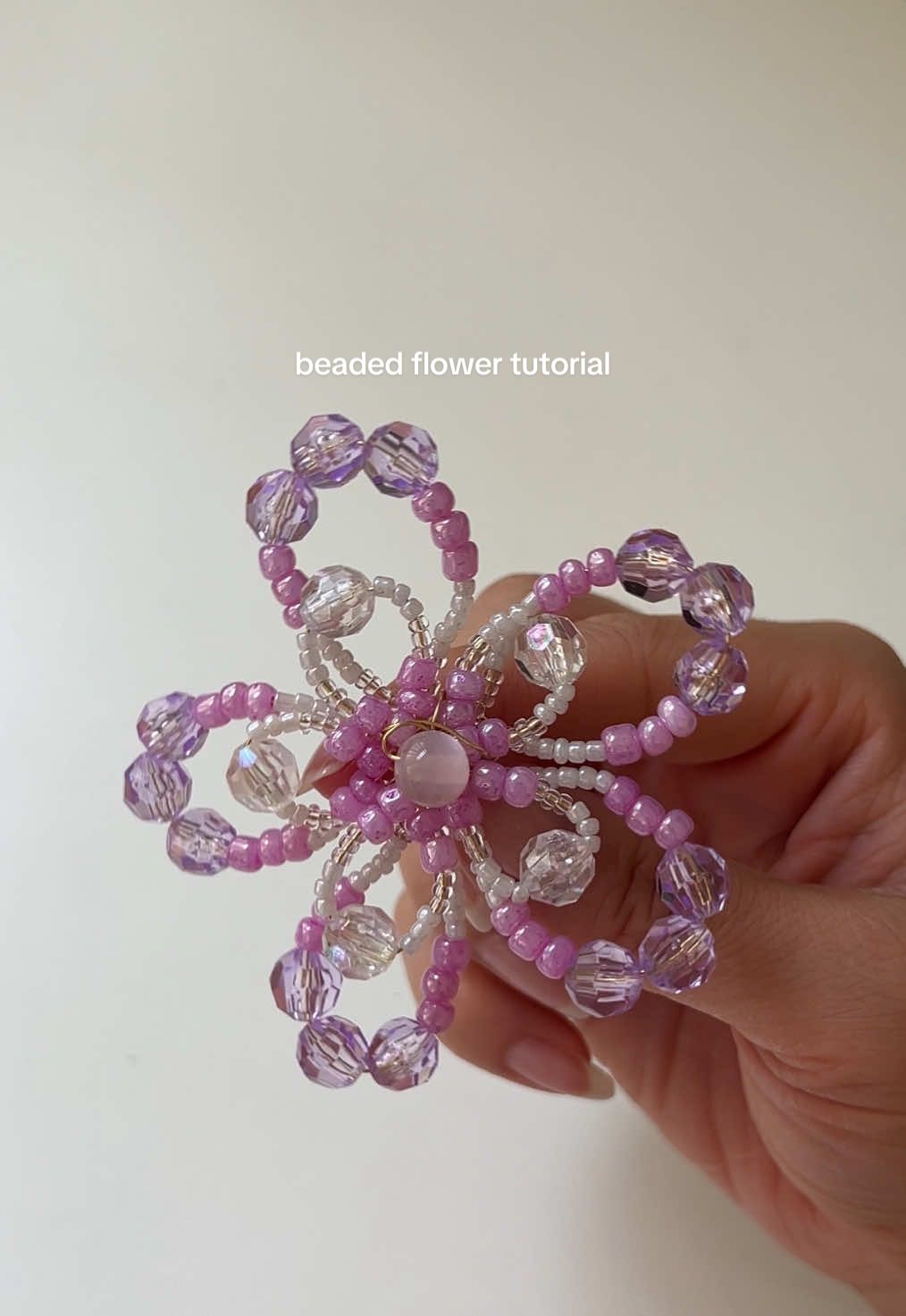 diy beaded flower tutorial! i make these for keychains & necklaces 🌸💜 #DIY #craft #diycraft #beading #beadedflower  