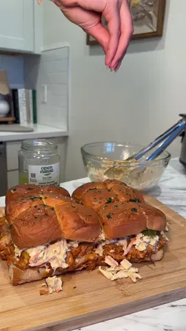 Forkful of Summer Episode 4: Hot Honey Buffalo Chicken Sliders 🍯 Recipe: Chicken  - 1lb boneless skinless chicken breasts - 1/2 cup chicken broth  - Drizzle of @Mike’s Hot Honey  - 2 tsp salt - 1 tsp pepper - 2 tsp paprika  - 2 tsp onion powder  - 2 tsp garlic powder  Coleslaw  - Bag of slaw  - 3/4 cup mayo - Drizzle of honey  - 1/2 tsp salt  - 1/4 tsp pepper - 1 tbs apple cider vinegar - 2 tsp mustard - 1 tsp paprika  Buns - @KING’S HAWAIIAN rolls - 2 tbs butter  - 1 clove garlic  - Parsley - Flakey salt - Cheese of choice (Cheddar or Monterey Jack cheese) Instructions: 1. Preheat crockpot on low for 30 minutes. Then put chicken, chicken broth, and seasonings in. Cook for 6-8 hours depending on how much chicken you add  2. Once the chicken is close to being ready, prepare coleslaw and garlic butter 3. When chicken is ready add buffalo sauce 4. Preheat oven to 425  5. Slide rolls in half and add chicken and cheese to the bottoms, and garlic butter on the tops 6. Keep separate and throw in oven until cheese is melted and the tops are starting to brown  7. Take out of oven and add coleslaw, pickles, and flaky salt to the top. Enjoy! 