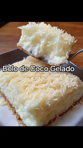 Bolo de Coco Gelado Simples e Molhadinho Ingredientes 4 ovos 1 xícara de leite 1 vidro de leite de coco (200 ml) 1 xícara de açúcar 2 colheres de sopa de manteiga 2 xícaras de farinha de trigo 1 colher de sopa de fermento em pó 1 pacote de coco ralado (100g) Calda 1 lata de leite condensado 1 vidro de leite de coco (200 ml) 1/2 xícara de leite Modo de Preparo Preaqueça o forno a 180°C e unte uma forma retangular. No liquidificador, bata os ovos, o leite, o leite de coco, o açúcar e a manteiga até obter uma mistura homogênea. Em uma tigela, peneire a farinha de trigo e o fermento. Adicione a mistura do liquidificador à tigela e mexa delicadamente até incorporar todos os ingredientes. Despeje a massa na forma preparada e asse por aproximadamente 35 a 40 minutos, ou até que o bolo esteja dourado e um palito inserido no centro saia limpo. Enquanto o bolo assa, prepare a calda: misture o leite condensado, o leite de coco e o leite em uma tigela. Após retirar o bolo do forno, fure-o com um garfo ou palito e, ainda quente, despeje a calda por cima, garantindo que o bolo fique bem molhadinho. Polvilhe o coco ralado sobre o bolo. Leve à geladeira por, no mínimo, 2 horas antes de servir. Para um sabor ainda mais especial, deixe gelar de um dia para o outro.