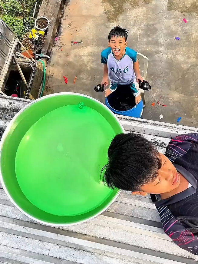 water Balloon raining 😂 challenge with brother #fun #fyp #tikok #shorts #ballons #ballonshorts #challange #entertainment #foruyou #waterballoon #funnytiktok 