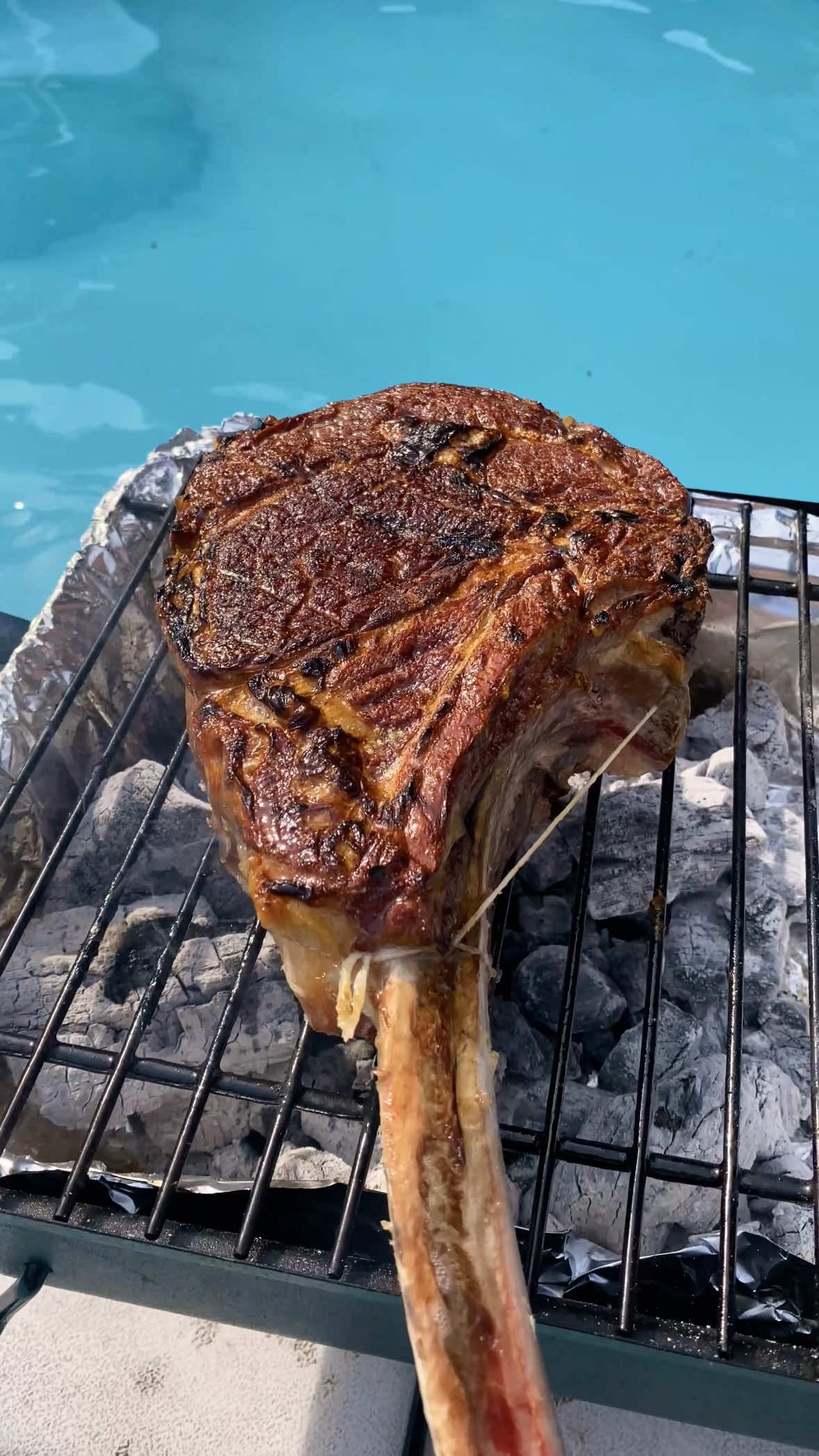 🌊🛟🥩 Makin Waves #TBT One of my most memorable cooks, hanging with my buddies drinking beer and grilling steak inside the pool 😂 🔥 Charcoal @Jealous Devil  🥩 Steak @notjuststeaksinc @ontariobeef  . . . #Steak #Tomahawk #Ribeye #Grilling #BBQ #Barbecue #pool #poolparty #Summer #cookout 