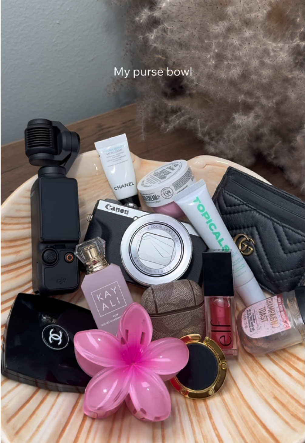Girly things🎀 Oh how I love being a woman💕 . . . @TOPICALS @Kayali @elfcosmetics @Sol de Janeiro @Bath & Body Works @SHEINUS @DJI Official  #pursebowl #whatsinmybag #whatsinmypurse #purseessentials #girlythings #girlessentials #makeup #beauty #pinterestaesthetic #digitalcamera #fyp 