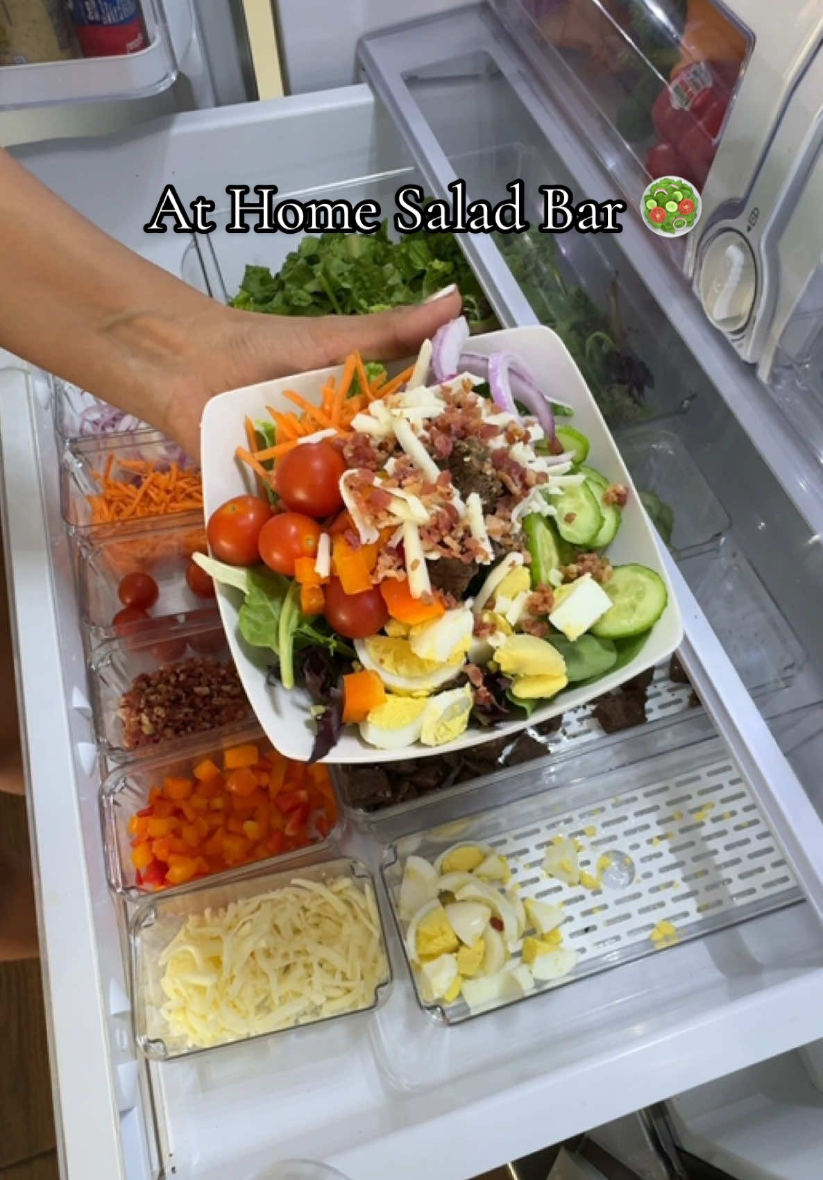 Salad bar at home vibes 🌿 Revamp your fridge organization with these amazing bins! #fridgeorganization #fridgerestock #saladbar #Foodie #organizedhome #kitchen #kitchenorganizing #fy #kitchenorganization #CapCut 