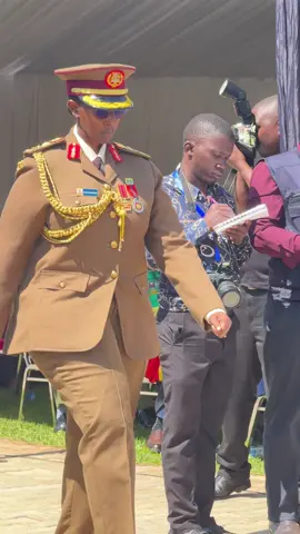 Brig Gen Charity Bainababo getting certificate of completion and saluting commander in chief, congratulations Afande 