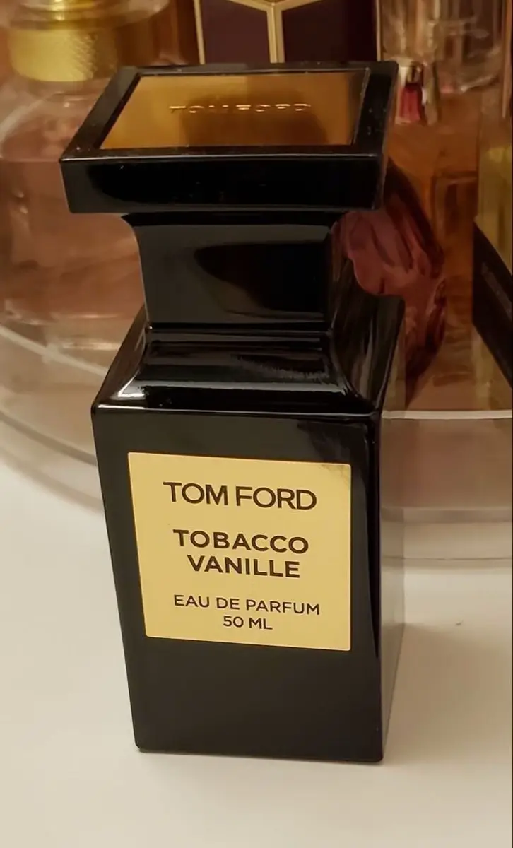 🌟Tom Ford Tobacco Vanille🌟 Released in 2007 and composed by the talented perfumer Olivier Gillotin, Tobacco Vanille by Tom Ford stands as one of the most recognizable and decadent offerings in the Private Blend collection. It is a fragrance that captures not just the essence of tobacco and vanilla but also the mood of an entire world—rich, intimate, and indulgently nostalgic. From the very first spray, Tobacco Vanille surrounds the wearer with a bold embrace of spicy tobacco leaf, tinged with aromatic ginger and clove. It’s not the rough, bitter tobacco of an ashtray, but the warm, honeyed scent of pipe smoke curling lazily in a mahogany-paneled room. This rich tobacco note is quickly softened and sweetened by a luxurious dose of creamy vanilla, introducing a duality that defines the scent from top to base. The interplay between spice and sweetness is where Tobacco Vanille thrives—it’s both commanding and comforting, masculine and feminine, heavy yet inviting. As it settles, the heart unfolds with dried fruits and tonka bean, adding depth and a hint of gourmand warmth. There’s a sense of opulence here, like sipping a glass of mulled wine next to a roaring fireplace. The vanilla becomes more pronounced, but never cloying, thanks to a subtle bitterness that keeps the fragrance balanced. Hints of cacao and woody notes begin to emerge in the base, lending a velvety finish that stays close to the skin, even as the scent projects with authority. In terms of performance, Tobacco Vanille is a powerhouse. Projection is strong for the first few hours—it easily announces your presence without being abrasive. The sillage is generous, trailing behind you in a warm, enveloping cloud. On skin, it lasts well over 10 hours, and on fabric, it can linger for days. This is not a fragrance for hot days or crowded spaces—it’s best worn in cooler weather, at night, or when you want to make a statement. Ultimately, Tom Ford’s Tobacco Vanille is not simply a perfume; it’s an experience. It’s a walk through a high-end cigar lounge, a conversation over old books and dark rum, a feeling of timeless elegance captured in a bottle. It’s ideal for those who love deep, warm, and spicy-sweet fragrances with a bold presence. More than anything, it’s a reminder that sometimes, the most memorable scents are those that tell a story—and Tobacco Vanille tells it with a rich, smoky whisper that lingers long after you’ve left the room. #TomFord #TobaccoVanille #LuxuryFragrance #NichePerfume #VanillaPerfume #TobaccoScent #BoldFragrance #OlivierGillotin #PerfumeLovers #FragranceAddict #ScentOfTheDay #FragranceReview #PrivateBlend #UnisexPerfume #PowerfulScent #PerfumeCollector #PerfumeCommunity #LongLastingPerfume #WinterFragrance #ElegantScent 