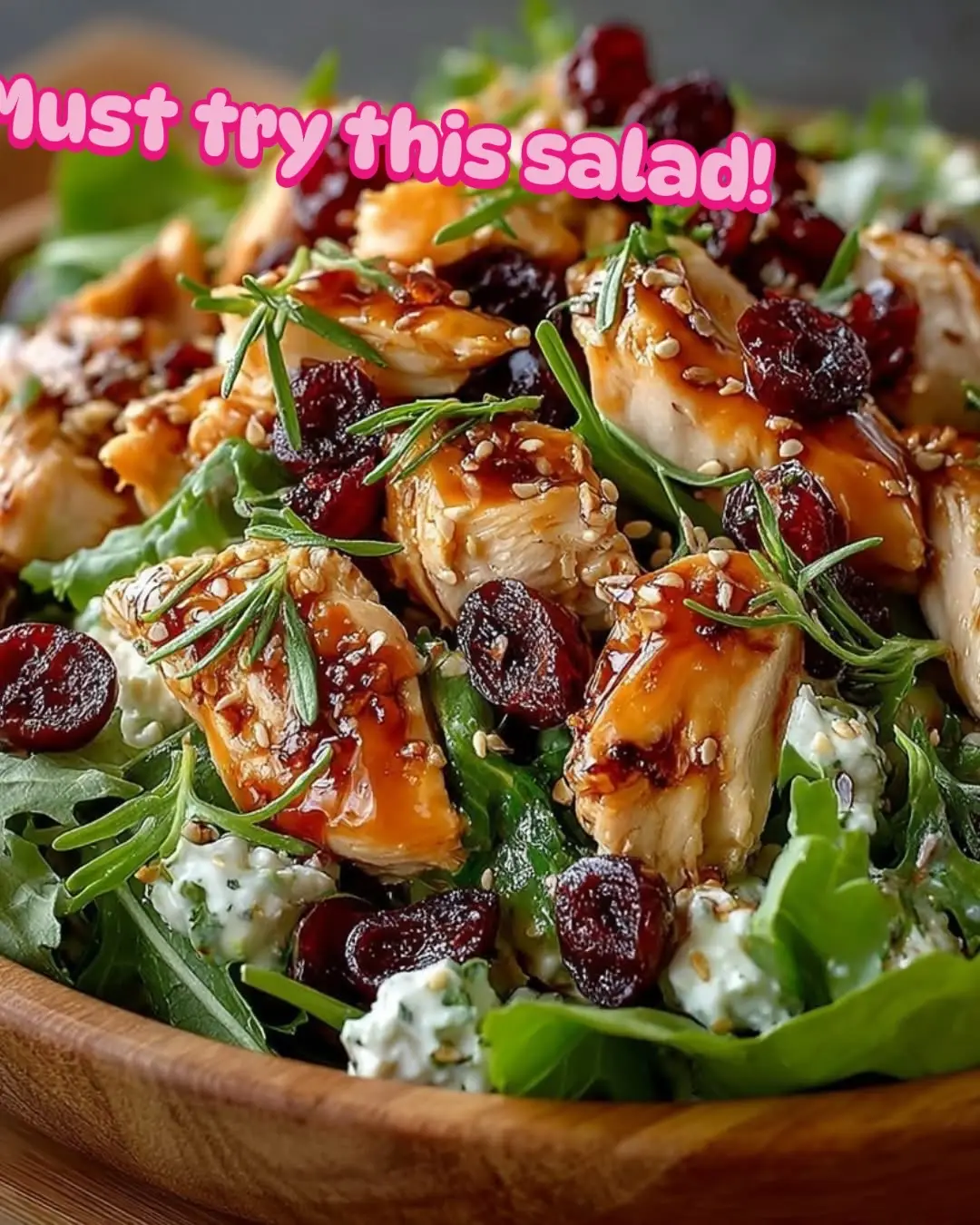 Asian Chicken Cranberry Salad Ingredients: 2 cups cooked chicken, shredded 1 cup mixed greens (such as spinach and arugula) 1/2 cup dried cranberries 1/4 cup sliced almonds, toasted 1/4 cup shredded carrots 1/4 cup green onions, chopped 1/4 cup sesame seeds For the Dressing: 3 tbsp soy sauce 2 tbsp rice vinegar 1 tbsp honey 1 tbsp sesame oil 1 tsp grated ginger 1/2 tsp garlic powder Preparation: In a large bowl, combine chicken, mixed greens, cranberries, almonds, carrots, green onions, and sesame seeds. In a small bowl, whisk together soy sauce, rice vinegar, honey, sesame oil, ginger, and garlic powder to make the dressing. Drizzle the dressing over the salad and toss gently to combine. Serve immediately or refrigerate for later. Enjoy!