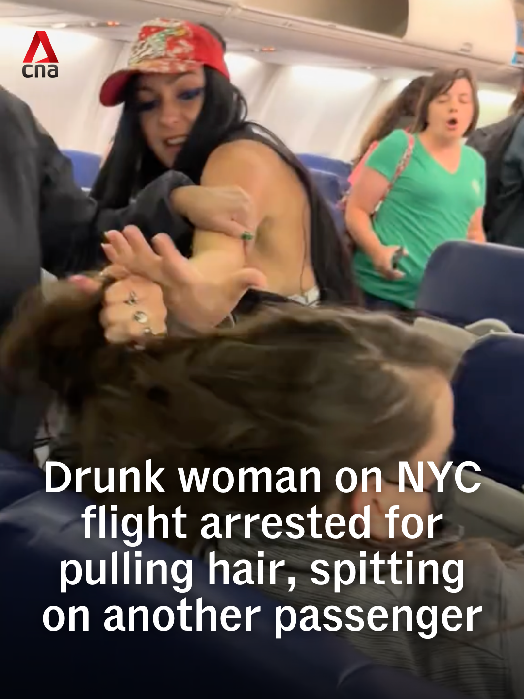 A drunk passenger was handcuffed and removed from a flight at New York's LaGuardia Airport on Tuesday (Jun 17) for physically and verbally assaulting another passenger. In videos posted on TikTok, the woman was seen grabbing a passenger's hair as well as spitting on and insulting her. #usnews #usa