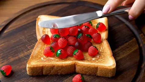 Spreading strawberry gummies and glowing fruit onto toast ASMR #asmr #asmrsounds #asmrvideo #oddlysatisfying #ai #asmrtiktoks #glassfruit 