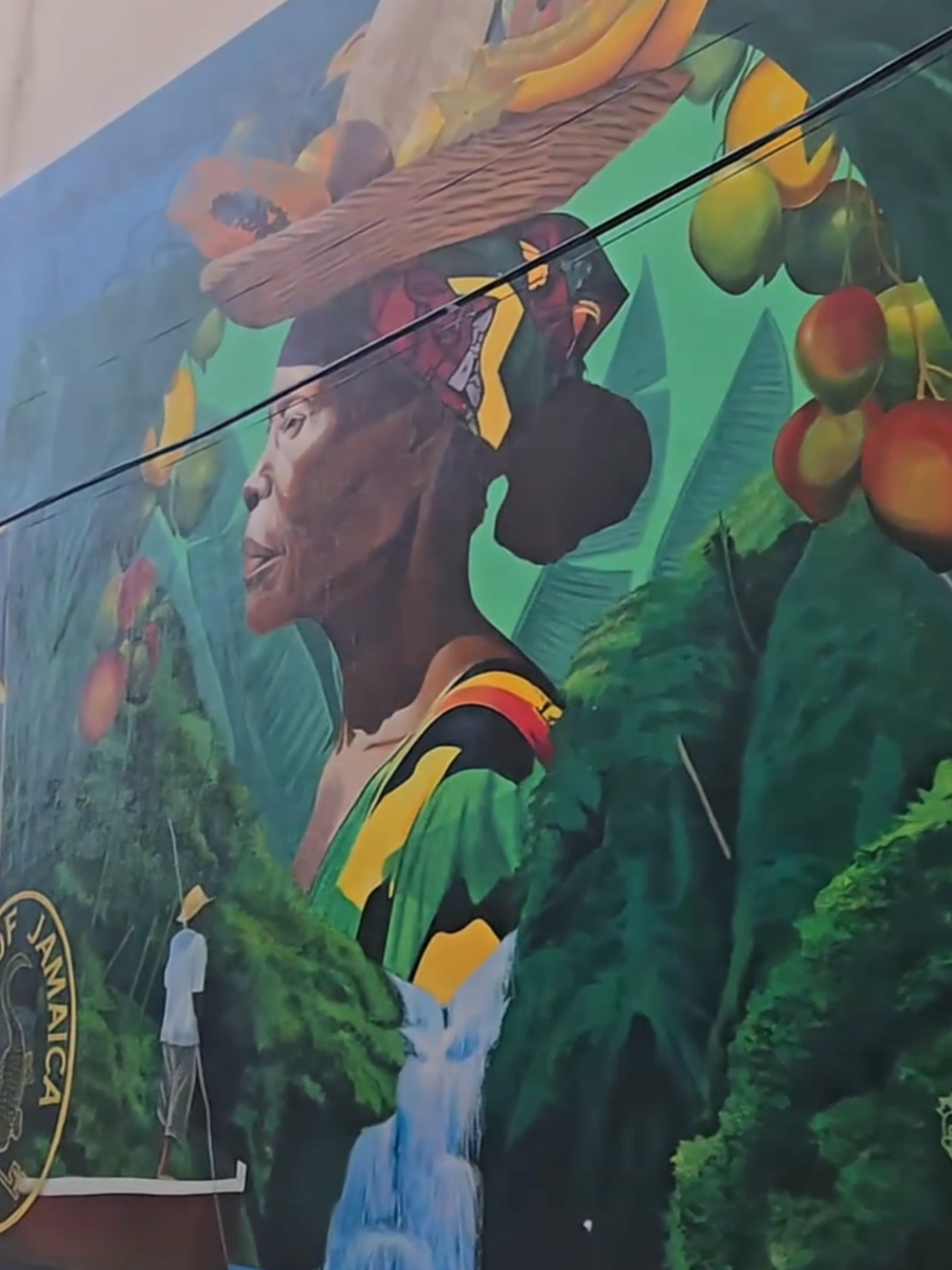 A striking mural by Jamaican artist Pamela Chen, created for the Central Bank of Jamaica, brings bold colour, national pride and fresh energy to Kingston’s streets. Supported by Jaevon Vassell and Shanelle Davis, this 2025 masterpiece is more than public art, it’s a vibrant fusion of creativity and culture and a powerful new addition to the Kingston Creative Art District, where Kingston’s streets continue to transform into living galleries.
