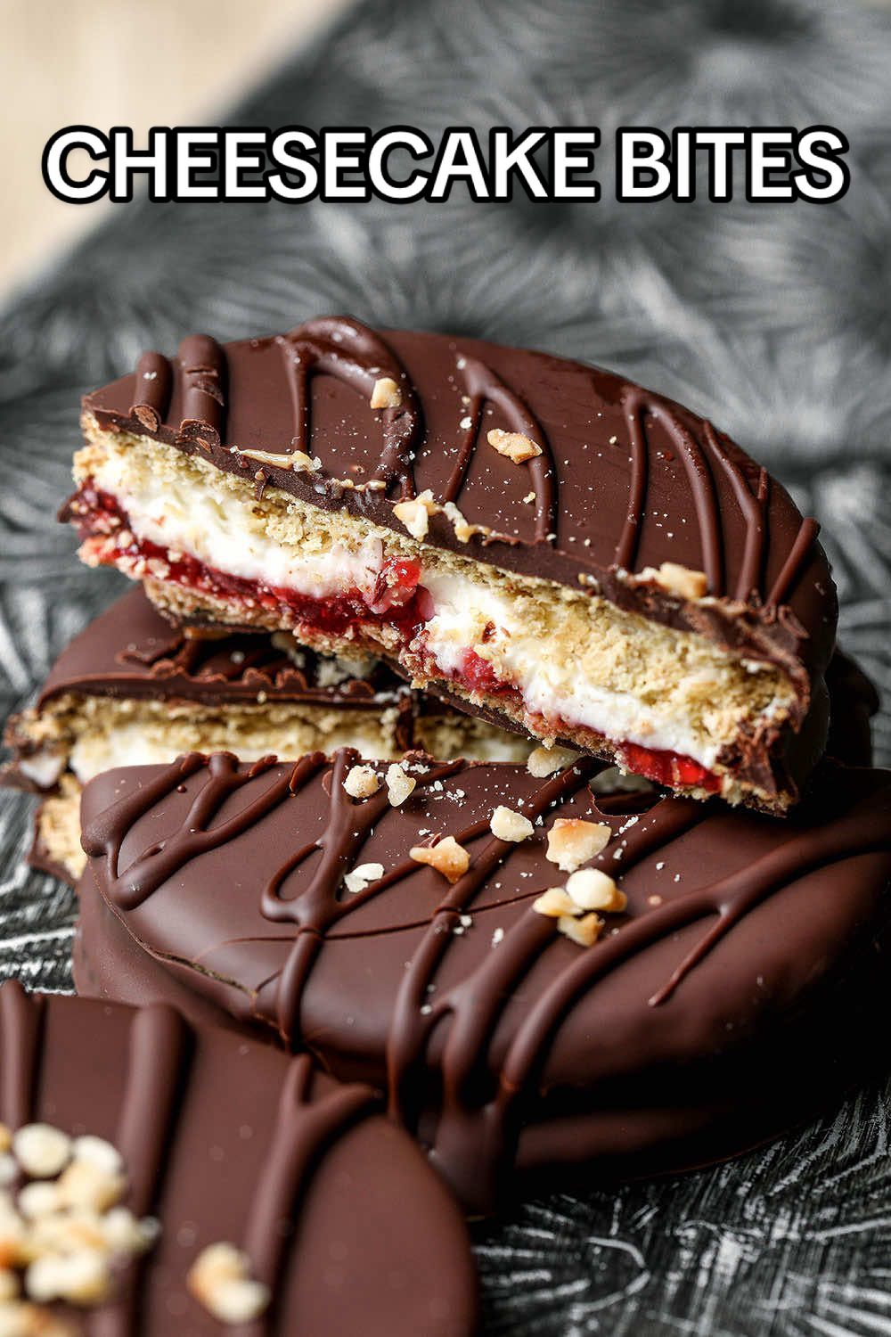 Healthy No-Bake Cheesecake Bites, for when you’re craving cheesecake but don’t want to spend hours in the kitchen! - 8 oat cakes* - 4 tbsp light cream cheese - 4 tsp jam of choice I used raspberry - 80g (1/2 cup) dark chocolate Simply spread the cream cheese onto one of the oat cakes and top it with a layer of jam. Sandwich with another oat cake and freeze for a couple of hours. Dip in melted chocolate to coat, then lay them on a baking sheet lined with baking paper. Refrigerate until the chocolate is set and enjoy!  * For non UK based viewers - oat cakes are basically a round cracker made with oats instead of wheat flour. Any type of cracker will work.  #sweettreats #tiktokeats #summerfood #summerrecipes #fastfoodlife #healthycheesecake #easydessert 