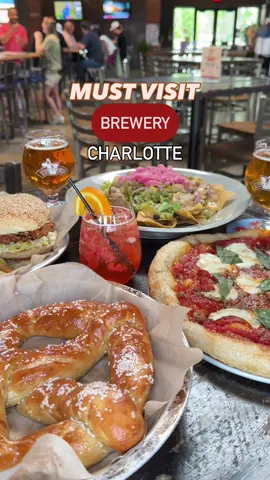 This is your sign to check out one of Charlotte’s must-visit breweries — Brewers at 4001 Yancey 🍻 With an ever-rotating lineup of 35–40 craft beers and ciders, you’ll find favorites from Victory, Southern Tier, Sixpoint, Bold Rock, and their locally brewed CLT Brew’d series — including a few Victory Monkeys you’ll definitely want to try (not just IPAs, promise 😉). The food? Just as good. Think Victory Pretzels, wings, nachos, pizza, fried chicken sandwiches, and more — all designed to pair perfectly with your pour. 🍕 🍻 Massive indoor/outdoor seating 🍻 Great retail shop (we left with a Victory mixed pack for poolside sippin’) 🍻 Perfect vibe for beer lovers ❗️21+ | Drink responsibly #cltbucketlist #charlottenc #cltbeer #cltbrewery #cltthingstodo #brewery #beer #victory #victorymonkeys @Brewers At 4001 Yancey @Victory Monkeys 
