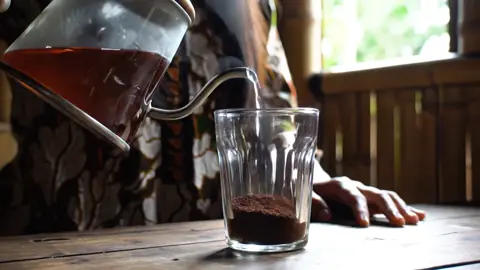 ASMR Video dari Veo3  prompt : A young Indonesian woman slowly pours hot water into a traditional kopi tubruk glass. Close-up on the bubbling coffee grounds, gentle steam rising. The sound is focused on the water pouring, glass clink, and subtle breath. Soft morning light through bamboo window, rustic wooden kitchen. Peaceful, slow motion, no music — just real sounds. #veo3 #veo2 #videoai #promptai #asmrvideo #aivideo #klingai #videoviral #fypindonesia #promptveo3 #googleveo 