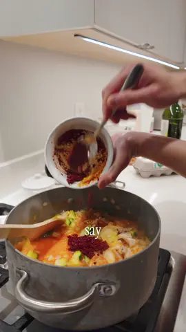 🔥🍜 Full recipe below! ⬇️⬇️ Korean Soondubu Jjigae (Soft Tofu Soup with Pork Belly) Macros per serving (approx.): Protein: 30g Carbs: 38g Fat: 32g Calories: 500 Ingredients (makes 2–3 servings): • 1 lb pork belly, thinly sliced • 1 pack soft tofu (soon tofu) • 1 pack instant ramen or fresh Korean noodles • 2 cloves garlic, minced • 1 small onion, diced • 1/2 zucchini, diced • 1 tbsp gochugaru (Korean red chili flakes) • 1 tbsp sesame oil • 1 tsp soy sauce (optional, for depth) • 2 cups kombu dashi (kelp broth – can sub with veggie or anchovy stock) • 1 egg • Salt to taste • Scallions (optional), for garnish How to make it: 1️⃣ Prep the chili oil base – In a small bowl, mix gochugaru with sesame oil (and soy sauce if using). Set aside. 2️⃣ Sauté aromatics – In a pot, lightly sauté diced onions and zucchini in a touch of oil or pork fat until softened. Add the red chili sesame oil mixture and stir to bloom the chili flakes (~30 sec). 3️⃣ Add broth – Pour in your pre-made kombu dashi and bring to a simmer. 4️⃣ Build the stew – Add sliced pork belly, then the ramen noodles. Let it cook for 2–3 minutes until the meat is mostly cooked. 5️⃣ Add tofu & egg – Gently spoon in chunks of soft tofu. Crack an egg on top and let it poach in the bubbling broth. 6️⃣ Finish & serve – Garnish with scallions (optional). Serve piping hot with steamed rice or enjoy as-is with the noodles. 📩 Save this recipe for your next cozy night in. If you try it, tag me—I’d love to see your version! #soondubu #koreanstew #porkbelly #spicytofu #ramenbowl #comfortfood #EasyRecipes