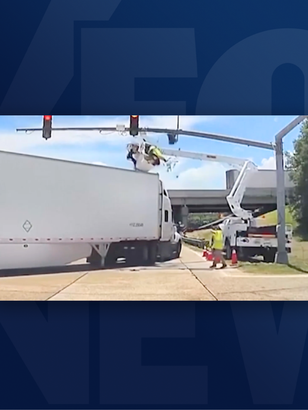 Harrowing footage shows an electrical worker dangling above an intersection in Louisiana after being struck by a semi-truck. The worker fortunately walked away without injury.