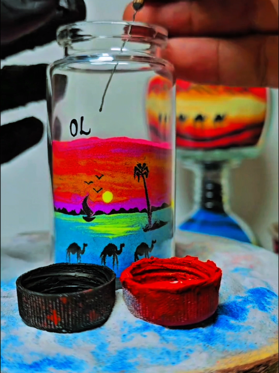 Drawing by sand color inside bottles #sand_art_in_dubai 