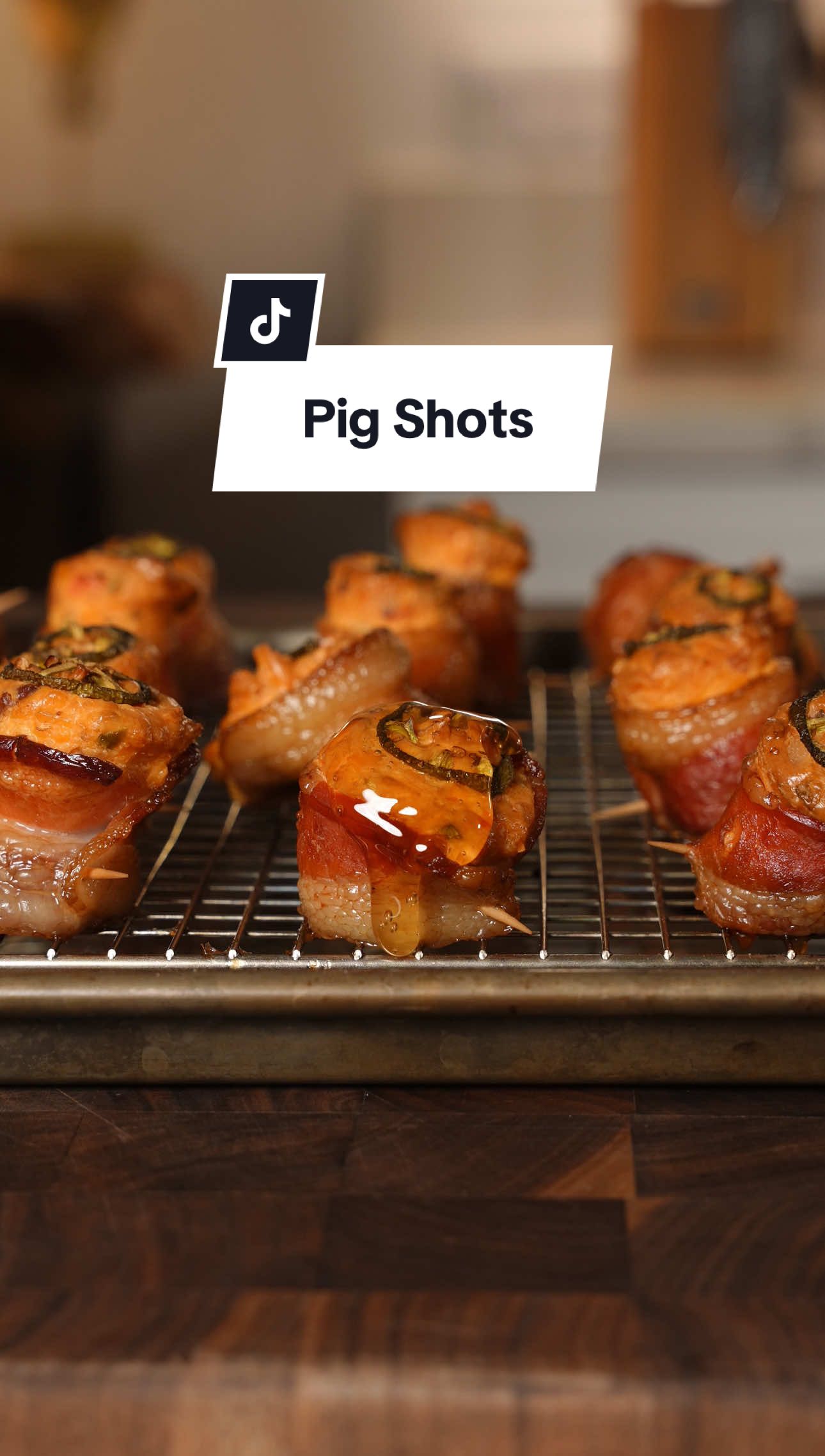 Pig Shots 🐷🥃😮‍💨 Recipe ⤵️⤵️⤵️ This recipe is perfect for this 4th of July weekend! I’m using the Limited Edition “Red White & BBQ” pellets from @Bearmountain BBQ these will add a firework show of flavor to your food this weekend! 🧨  Makes about 20-22 Pig Shots Ingredients:  12 oz Beef Smoked Kielbasa 1 lb “Thick” Cut Bacon 12 oz Pimento Cheese 8 oz Whipped Cream Cheese 1 Tbsp BBQ Rub 4 oz Cheddar Cheese 3 Jalapeno 2 oz Cooked Bacon Pieces 4 Tbsp Honey How to:  1. Cut Kielbasa 1/2 an inch thick and cut bacon strips in 1/2 2. Roll Bacon around the Kielbasa and use a toothpick to secure 3. In a bowl add Pimento Cheese, Cream Cheese, BBQ Rub, Cheddar Cheese, 1 chopped Jalapeño, Bacon pieces, and mix until well combined 4. Add mixture to a ziplock bag to make a piping bag and add to the pig shots and top with a slice of Jalapeño  5. In the Smoker or Oven at 250 degrees for about 2 hours or until the bacon is done 6. Top with Honey and enjoy! #bbq #pigshot #appetizer #Recipe #idea 