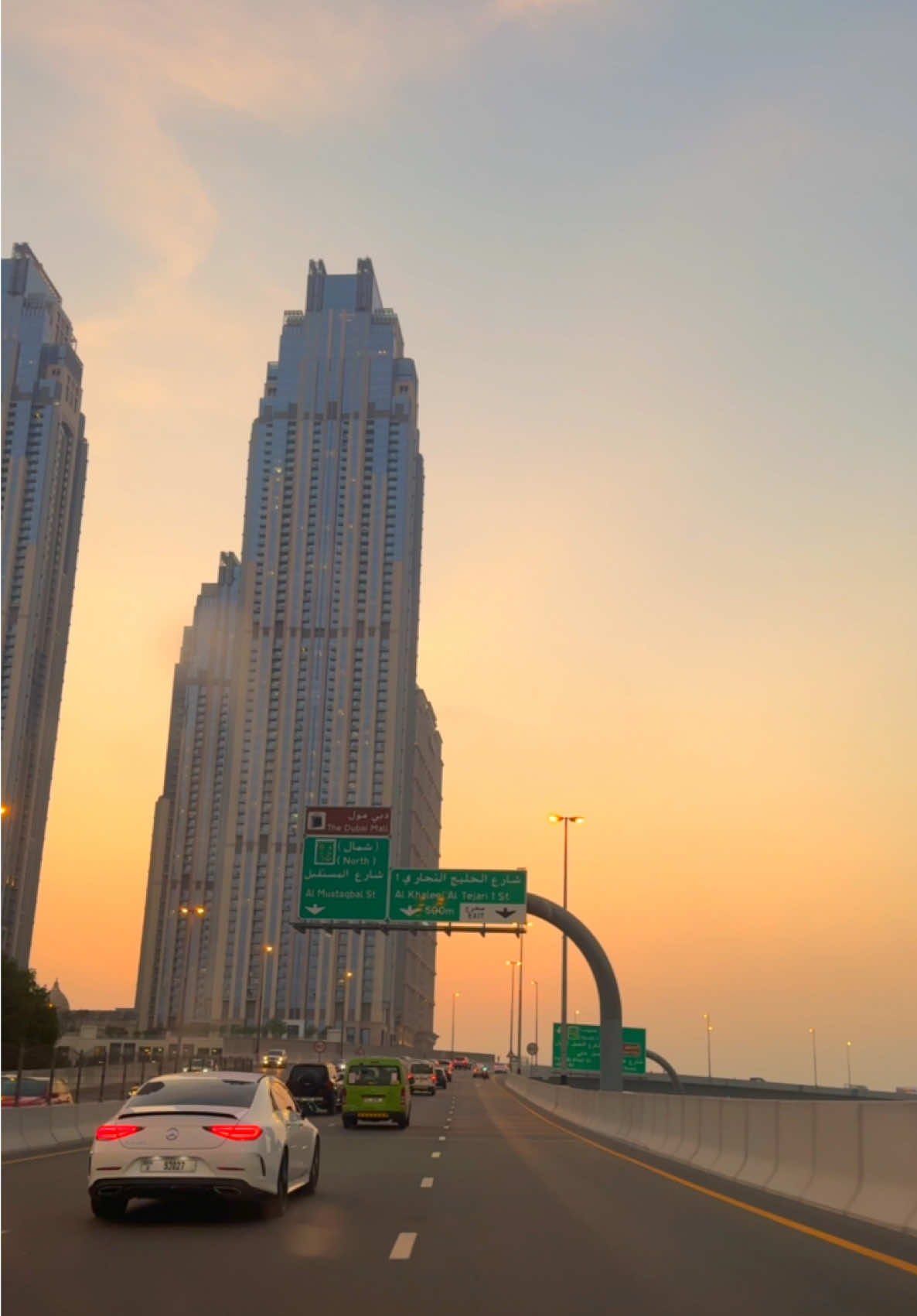 Part - 100 | “Evenings in Business Bay come alive with the glow of Al Habtoor City and JW Marriott. As the sun sets, the skyline turns into a golden masterpiece☀️✨💥💫🥀.” Driving through Al Amaal Street into Business Bay during the evening is a mesmerizing experience. The towering elegance of Al Habtoor City and the iconic JW Marriott, set against the backdrop of a fiery sunset, creates a view that’s nothing short of breathtaking. It’s a moment that stirs the soul—where city lights meet nature’s golden hour in perfect harmony.”  #dubai #burjkhalifa #evening #businessbay #sunset #beautyofdubai 