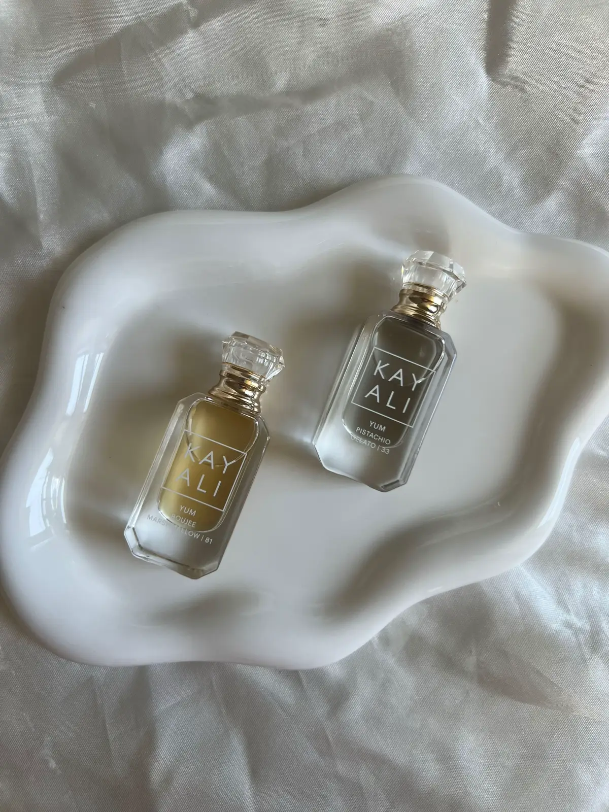 My two favourite minis from @Kayali ✨🤎💕 Finally got my hands on these last week while shopping at Sephora, beautiful fragrances! ✨ Mini YUM Perfume Duo Set ✨ 💛 YUM Boujee Marshmallow | 81 - notes of pink marshmallow, succulent strawberry, creamy coconut, whipped vanilla, & pink musk 🤎 YUM Pistachio Gelato | 33 - notes of pistachio, whipped cream, roasted hazelnut, & sweet rum I love these both. Beautiful cute packaging. They both smell amazing! Perfect to throw in my purse 👜 & on the go. And lasts all day!  @sephoracanada  - #sephora #sephoracanada #kayali #kayaliperfume #monakattan #fragrances #perfumetiktok #perfumes #vanitymakeup #duo #viral #fyp #aesthetic #ugc #contentcreator #ugcphotography #ugccreator #beauty #makeup #creatorsearchinsight 