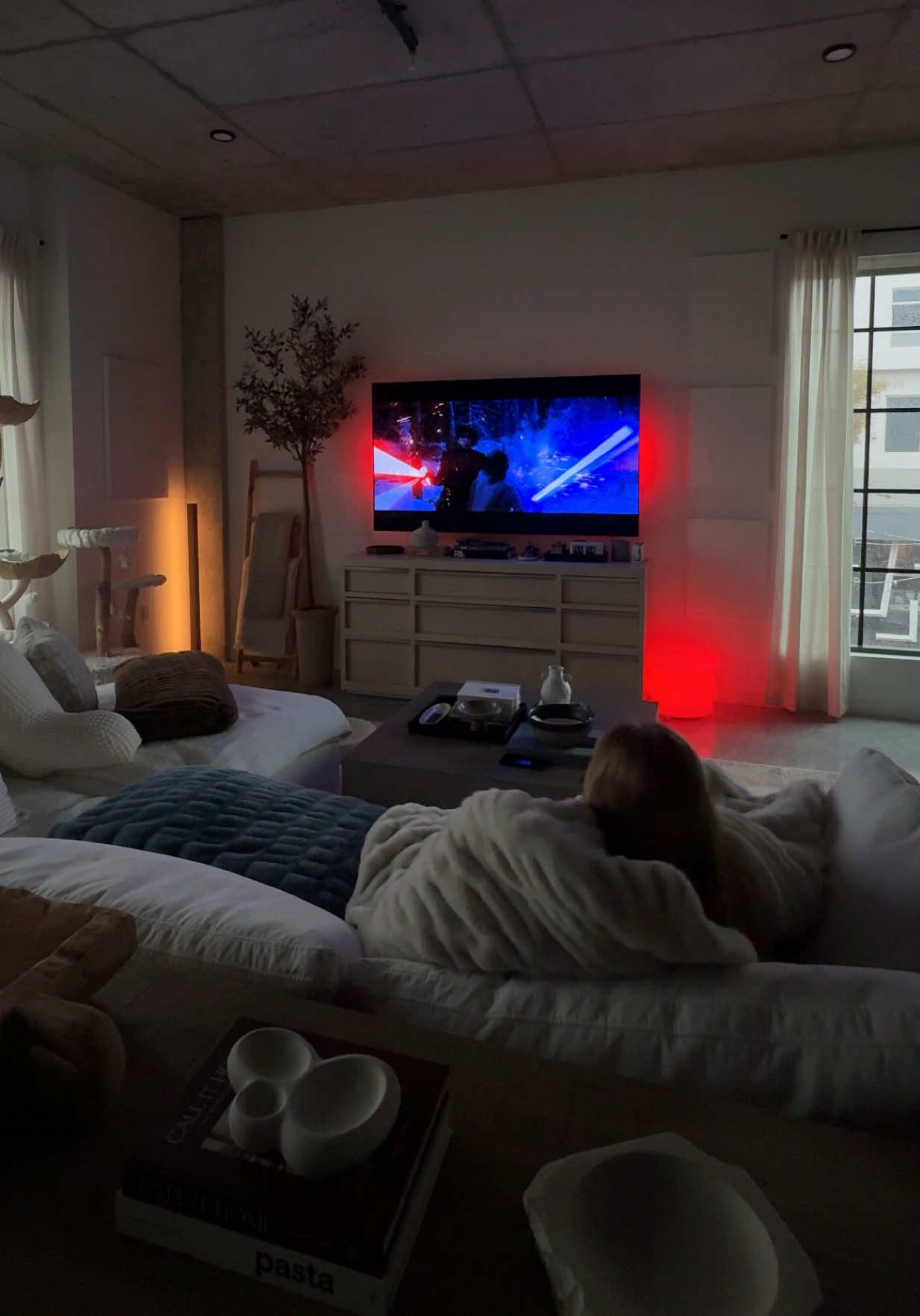 rainy day mood loading… ⛈️🕯️🤝🏼  #apartmentliving #rainy #gloomy #rainyday #gloomyweather #cozyday #cozygirl #livingroomideas #starwars 