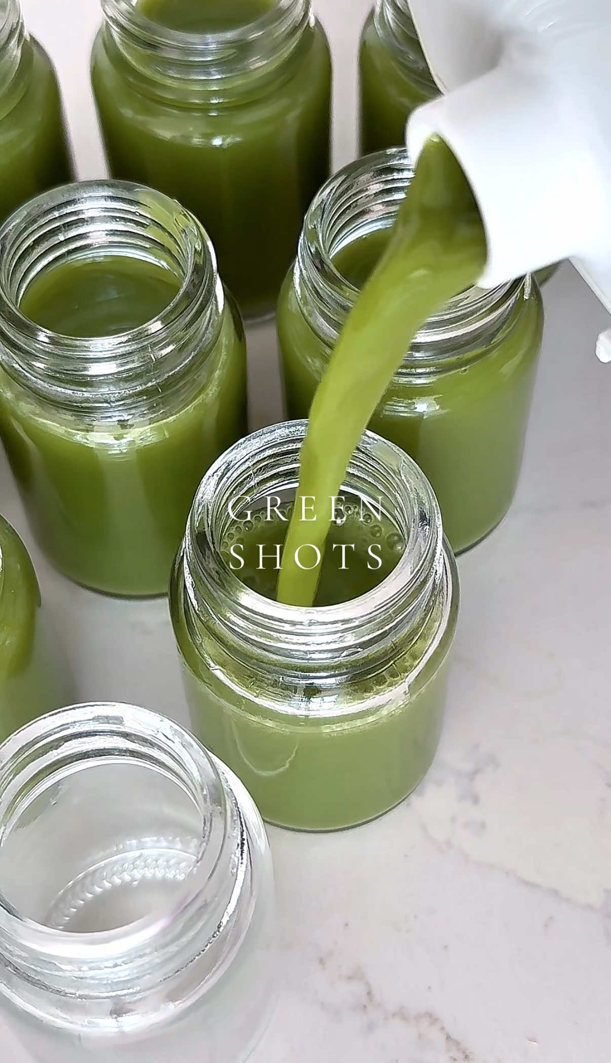Green wellness shots 🥒🍏🌿 Recipe for 18 shots: 0.5 lb ginger 🫚  1 green apple 🍏  1 cucumber 🥒  1 lemon 🍋  Handful of spinach  16 ounces coconut water 🥥  6 celery stalks 1/4 tsp cayenne pepper #wellnessshots #wellness #gingershots #asmr #satisfying #wellnesstips #healthy #digestion #Lifestyle #viral #organizedhome #SelfCare #immunity #restock 