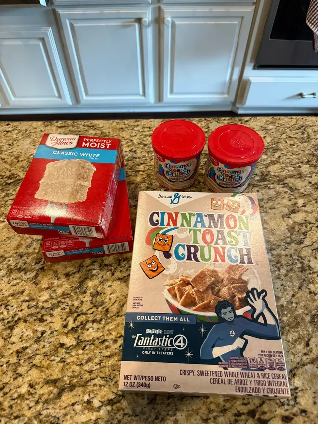 1 box vanilla or yellow cake mix 1 ½ cups milk 1 stick (½ cup) melted butter 3 large eggs 1 teaspoon ground cinnamon 2 tablespoons brown sugar Crushed Cinnamon Toast Crunch cereal  Icing & Topping: Cinnamon Toast icing (store-bought or homemade) Additional Cinnamon Toast Crunch cereal (for garnish)