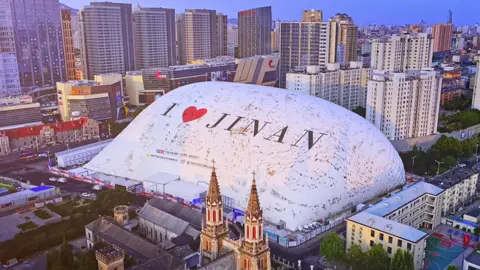 Aiming to reduce dust and noise pollution, China builds 50m-tall inflatable dome over a construction site in Jinan, Shandong province .