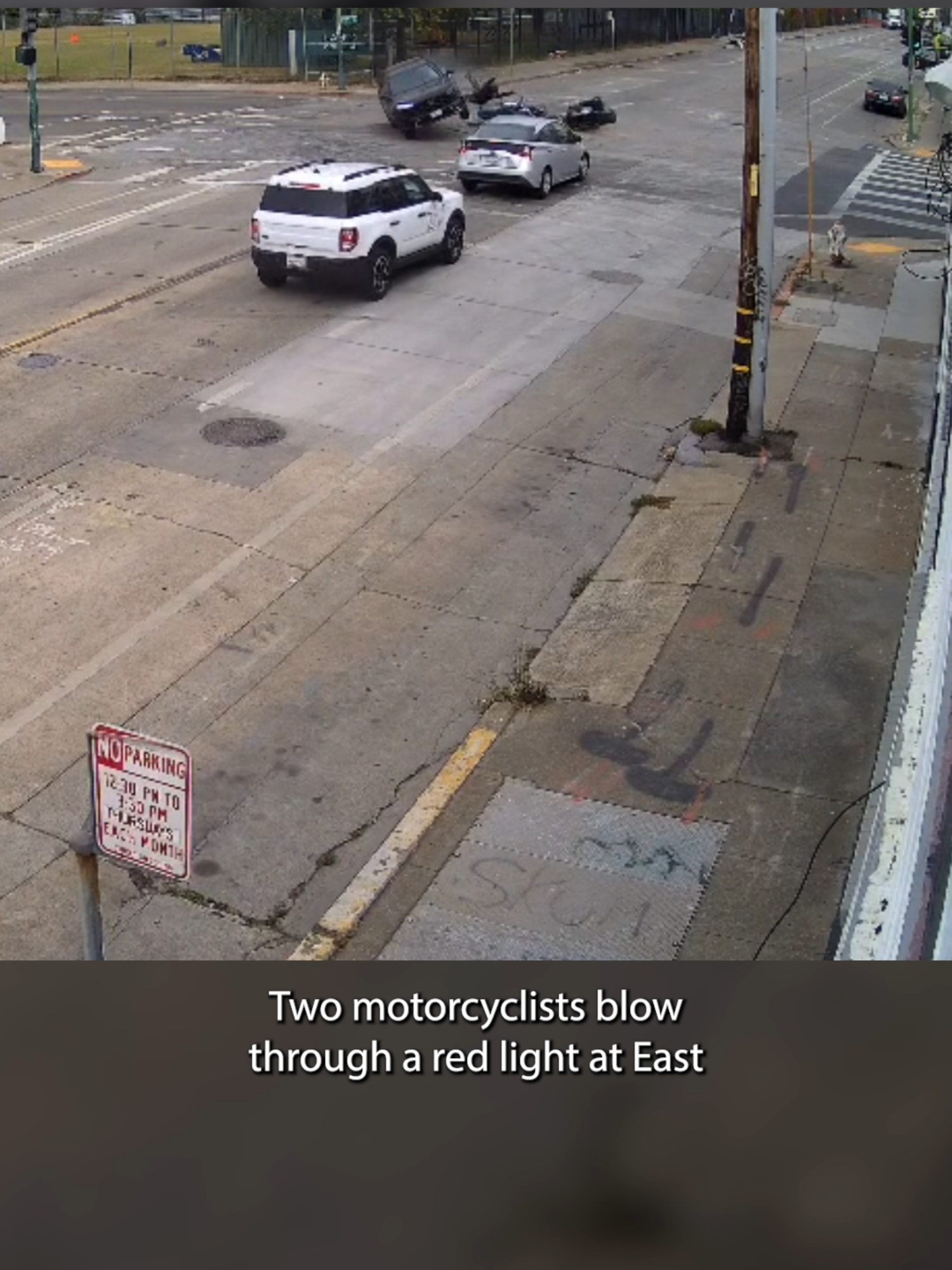 A wild crash involving two motorcyclists in Oakland on Wednesday morning was caught on camera. Video shows the riders blowing through a red light at East 10th Street and 5th Avenue around 9:06 a.m., slamming into a Honda SUV one after the other.